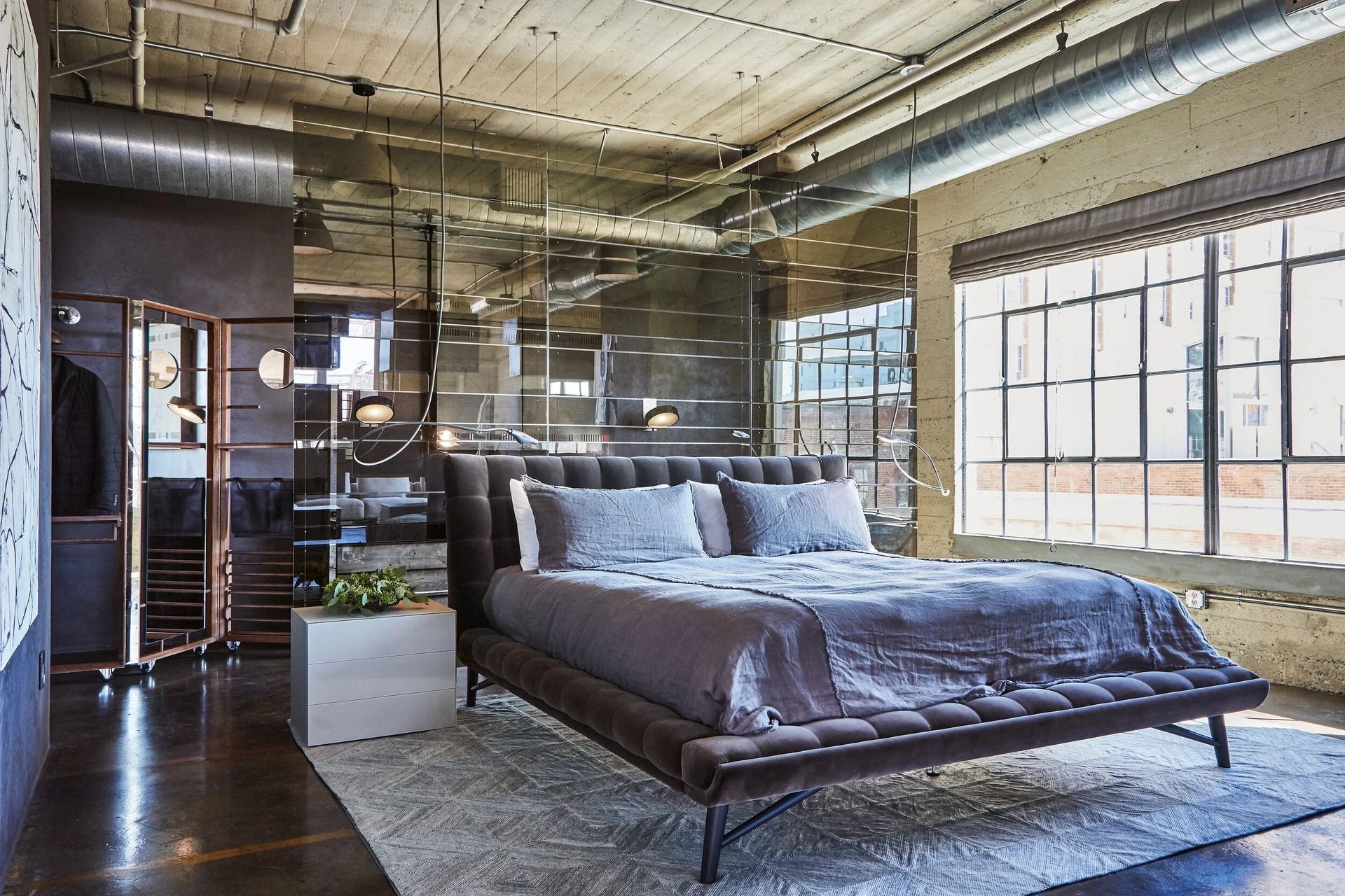industrial-loft-bedroom-mirrored-walls-gray-linenswebp-ap-compressed.jpg