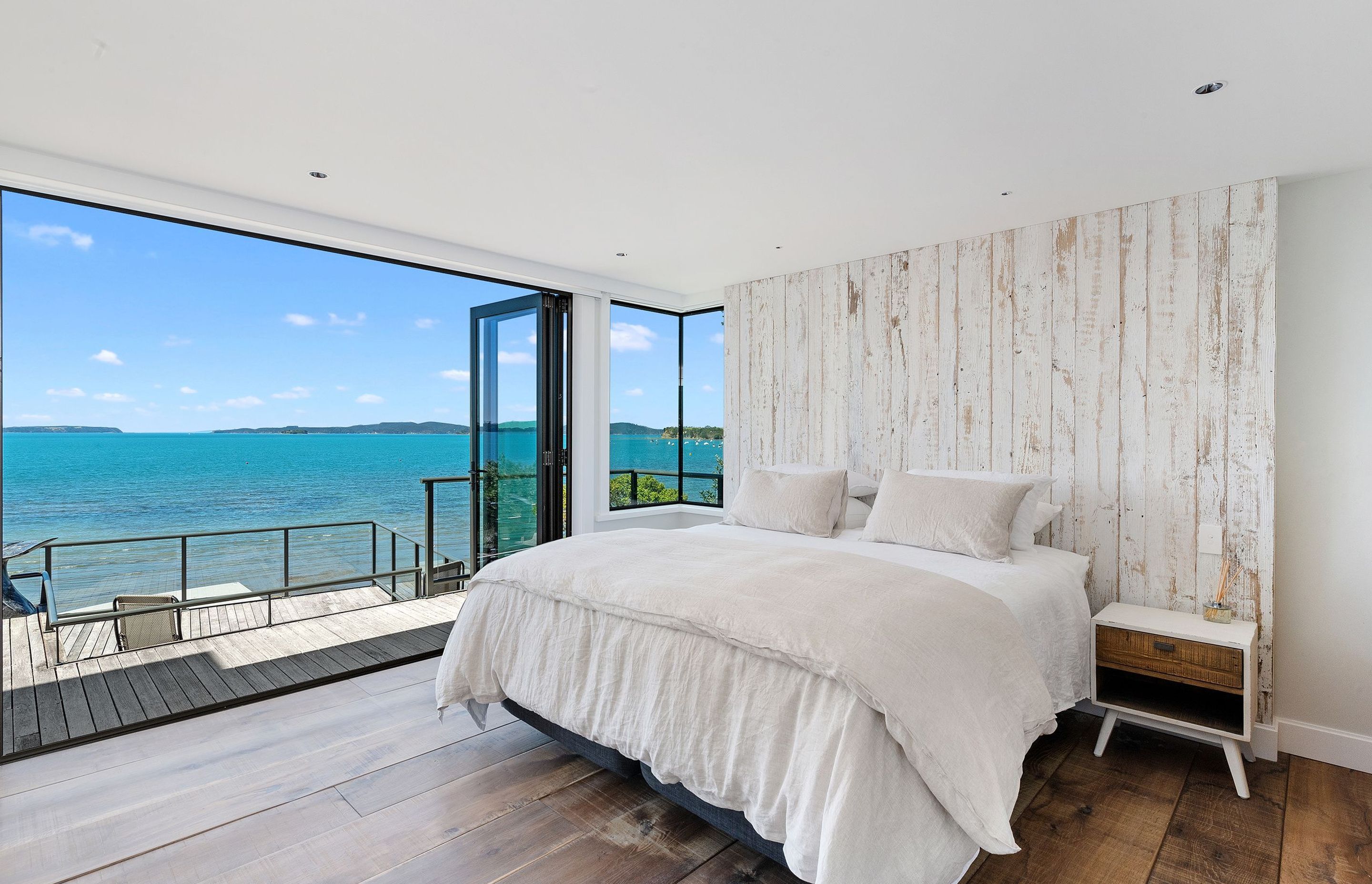 The main bedroom has been pared right back to only contain the bare essentials and given a relaxed feel, enhanced by the bare timber floor and headboard.