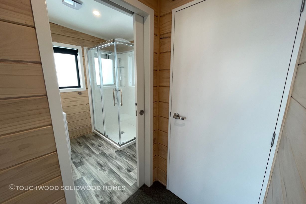 Left: Bathroom with access through cavity slider. Right: Laundry with extractor fan.