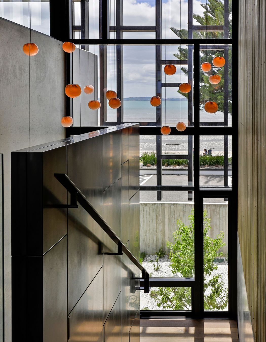 Climbing the stairs, the sea view is taken in through the timber fretwork pattern.