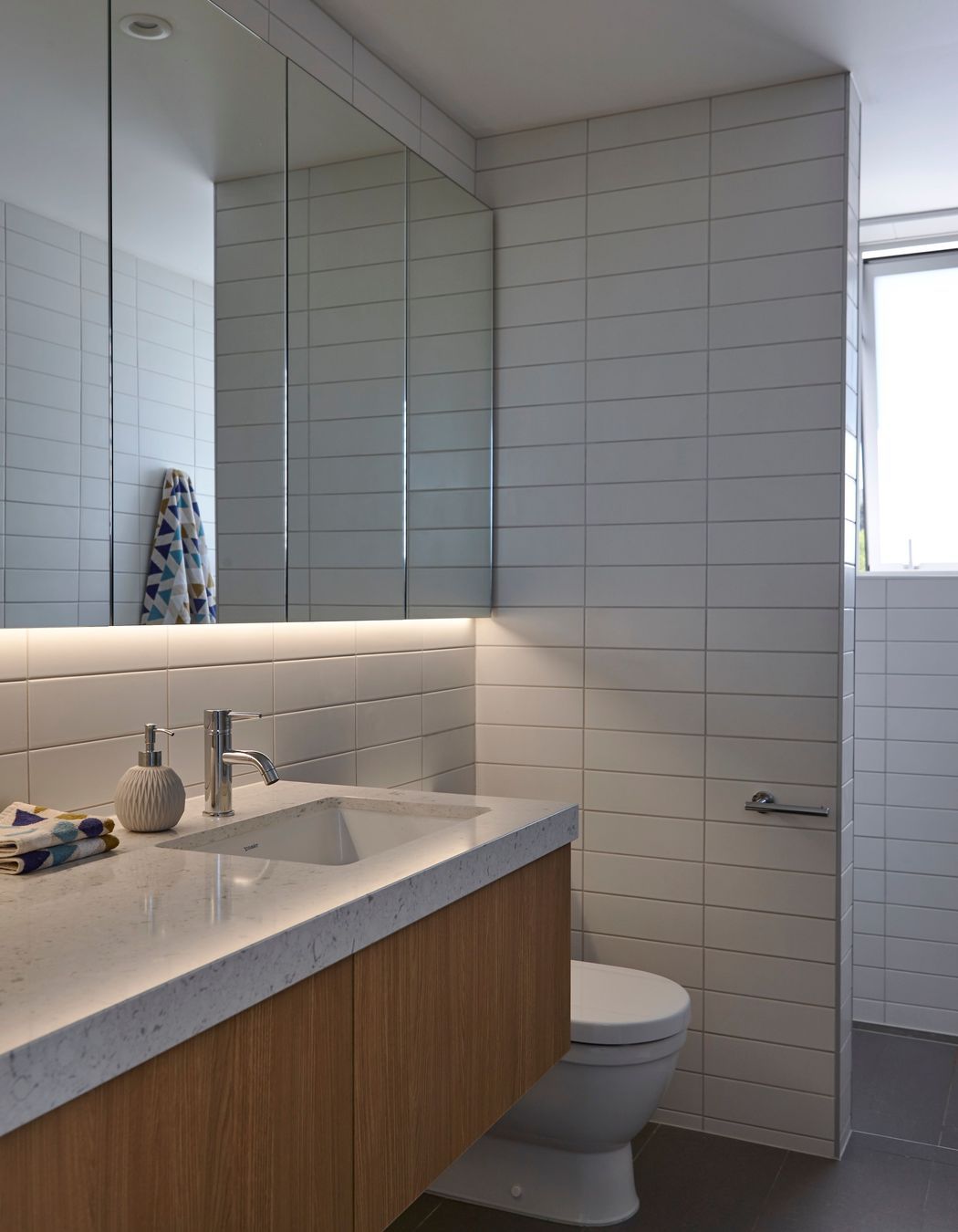 A lot of thought went into the spatial planning. “When you arrive, and you’ve just done the big drive, there’s a bathroom right there, there’s a place to lock up the boat, and there’s a place to put down the shopping,” says Kate.