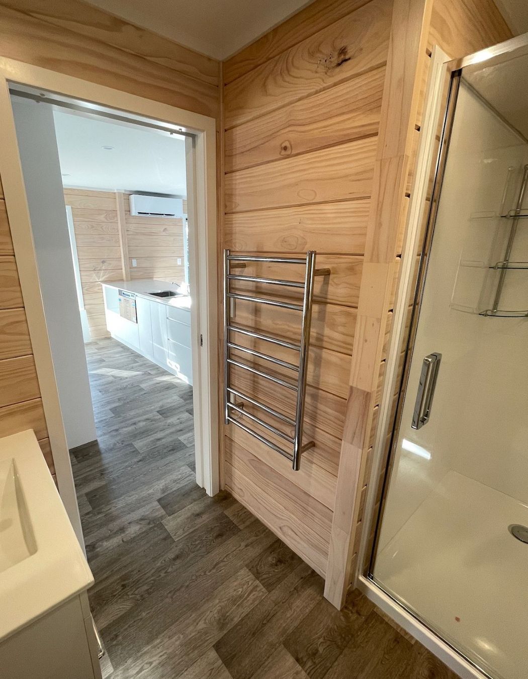 L-shaped bathroom with alcove shower (incl showerdome), HTL and pocket slider.