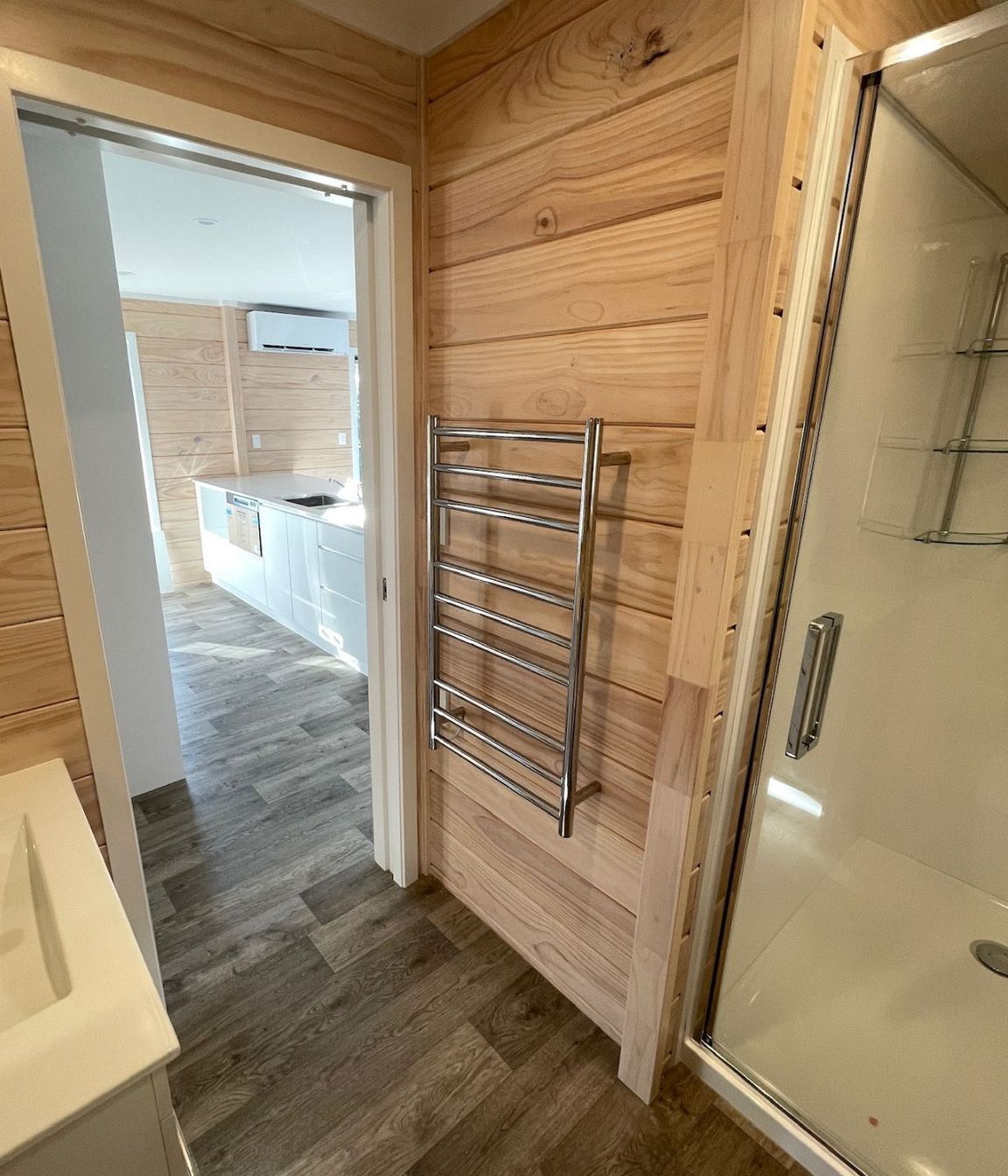 L-shaped bathroom with alcove shower (incl showerdome), HTL and pocket slider.