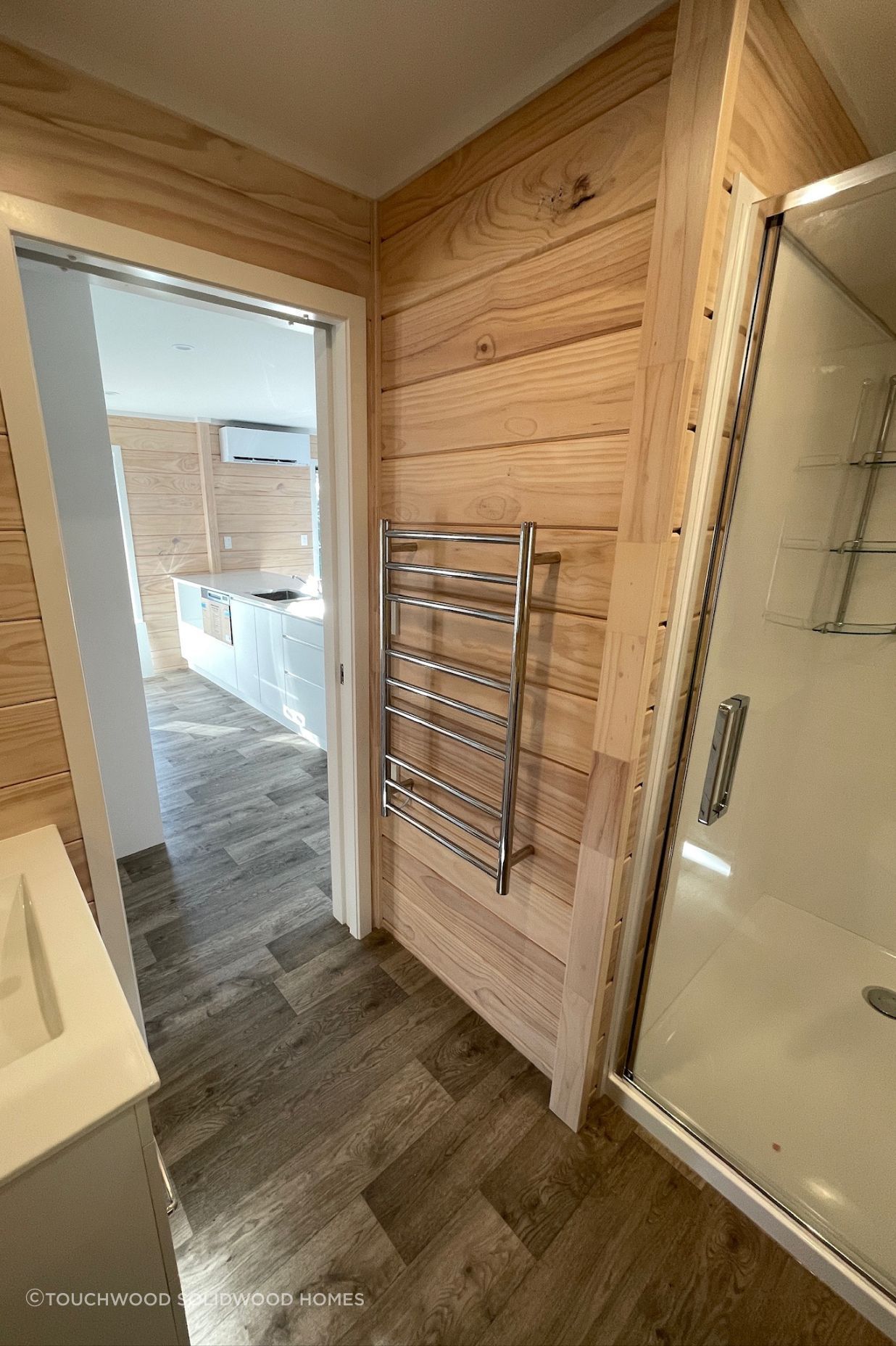 L-shaped bathroom with alcove shower (incl showerdome), HTL and pocket slider.