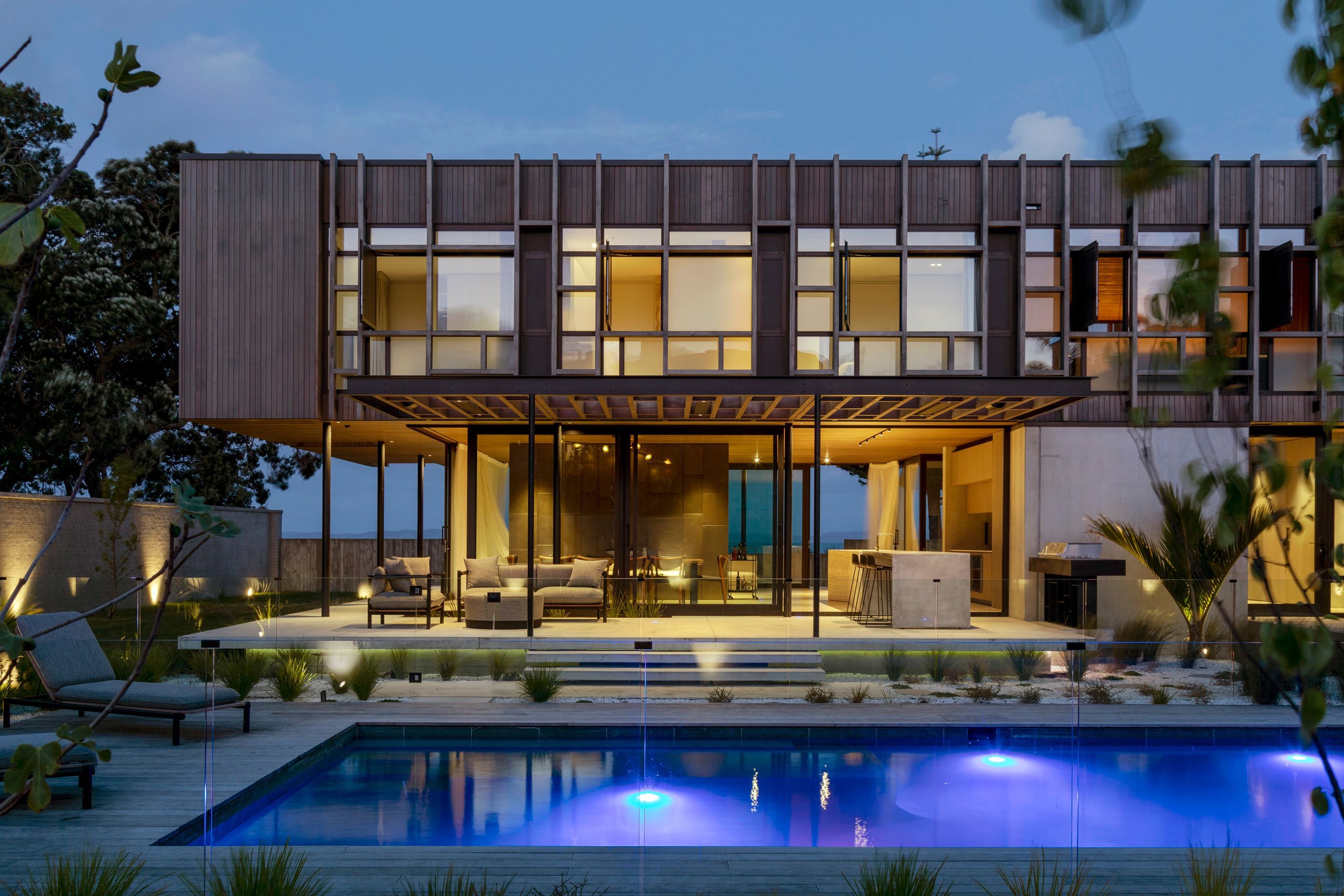 At night the outdoor living spaces light up for outdoor dining.