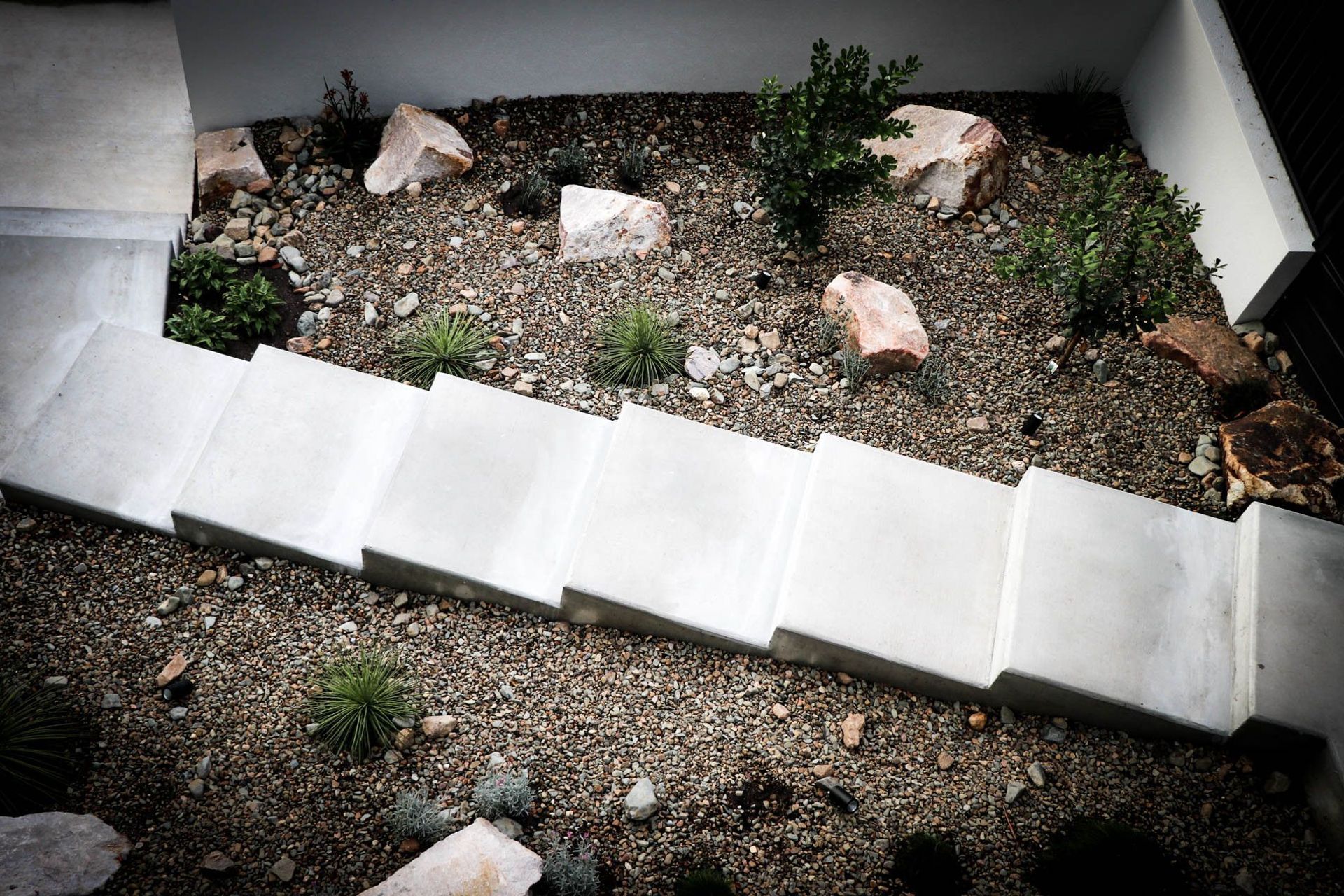 Anderson Residence - Garden. Boulder and native garden beside the stair.