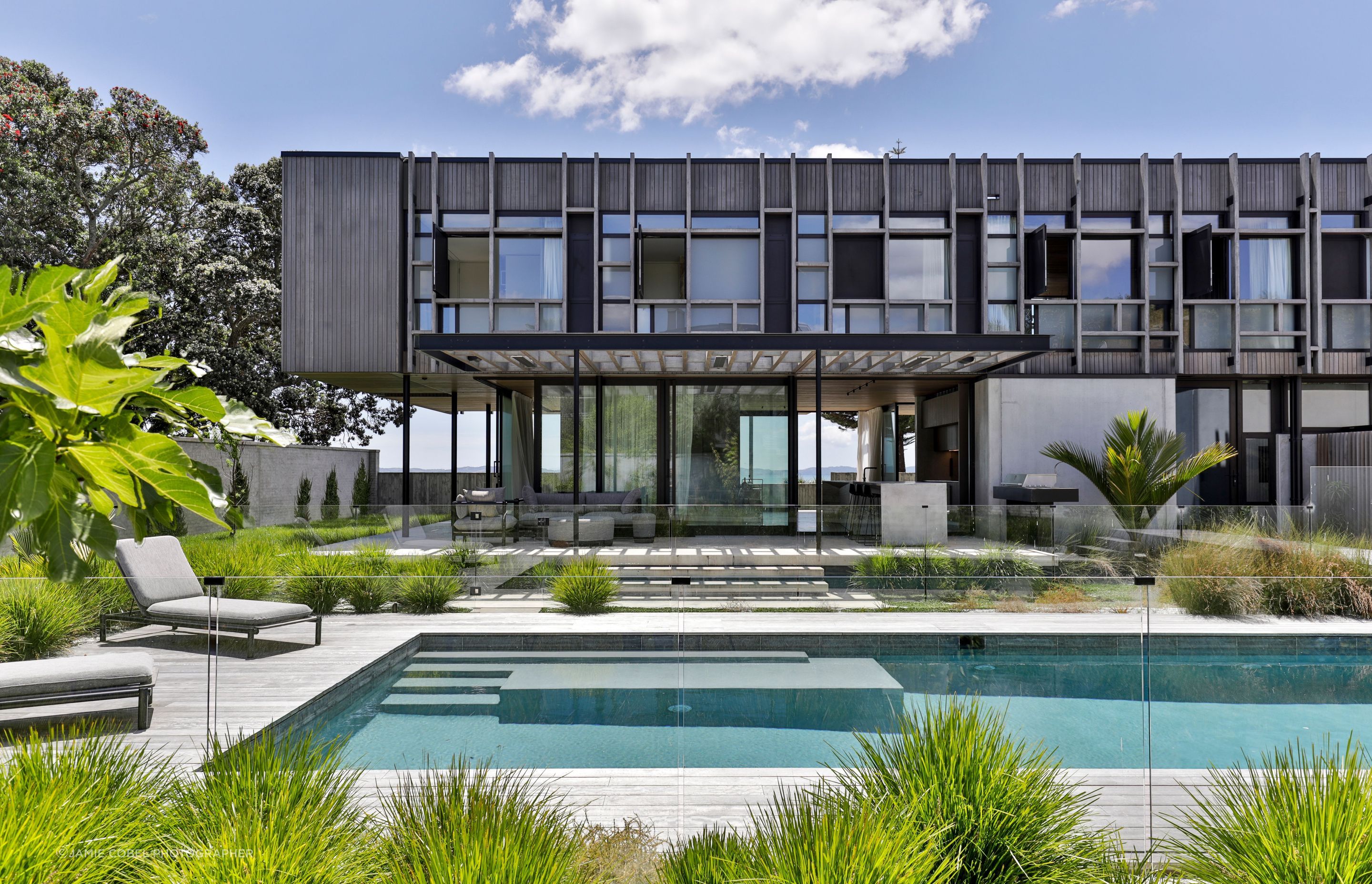 At the rear of the house, an outdoor living area and pool are a drawcard for the extended family.