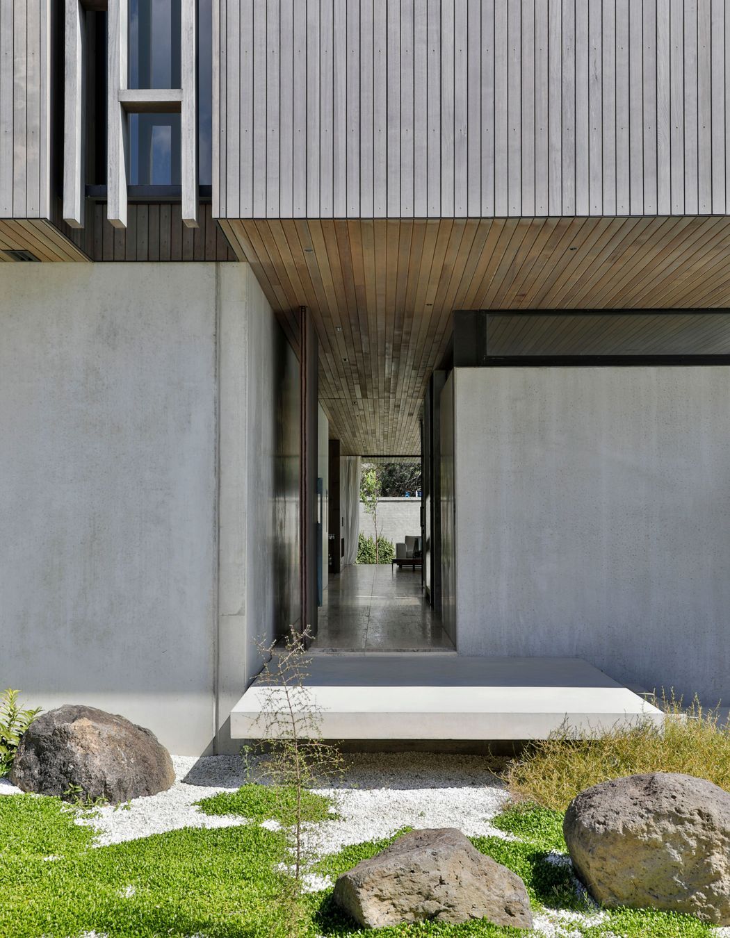 The front door leads visitors directly down a hallway to the living spaces.