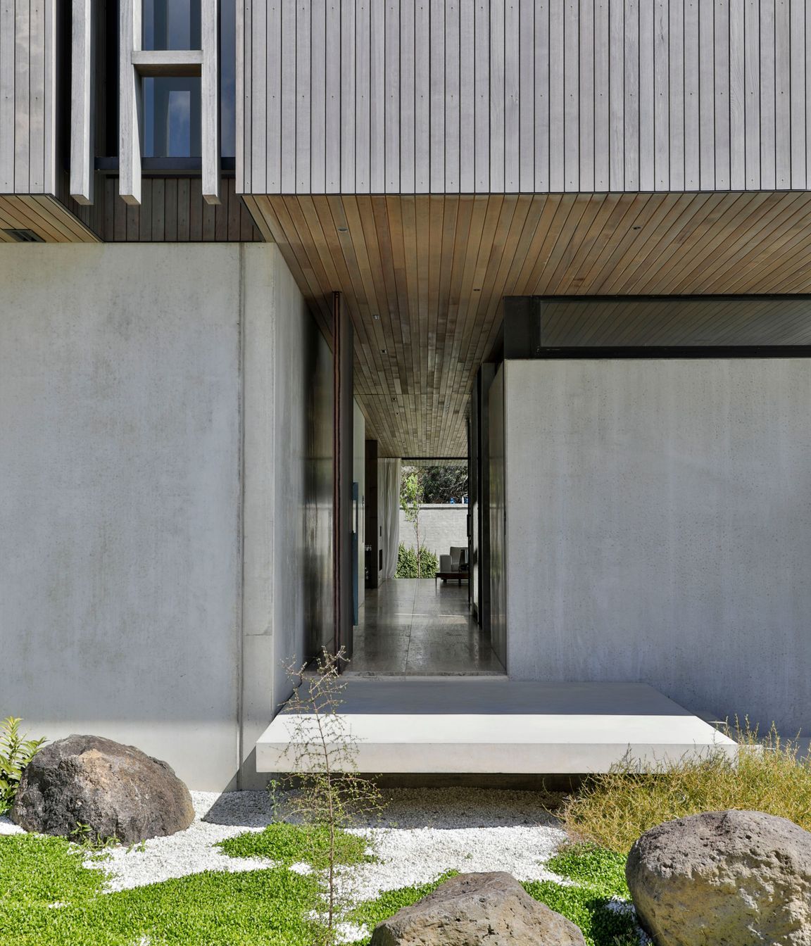 The front door leads visitors directly down a hallway to the living spaces.