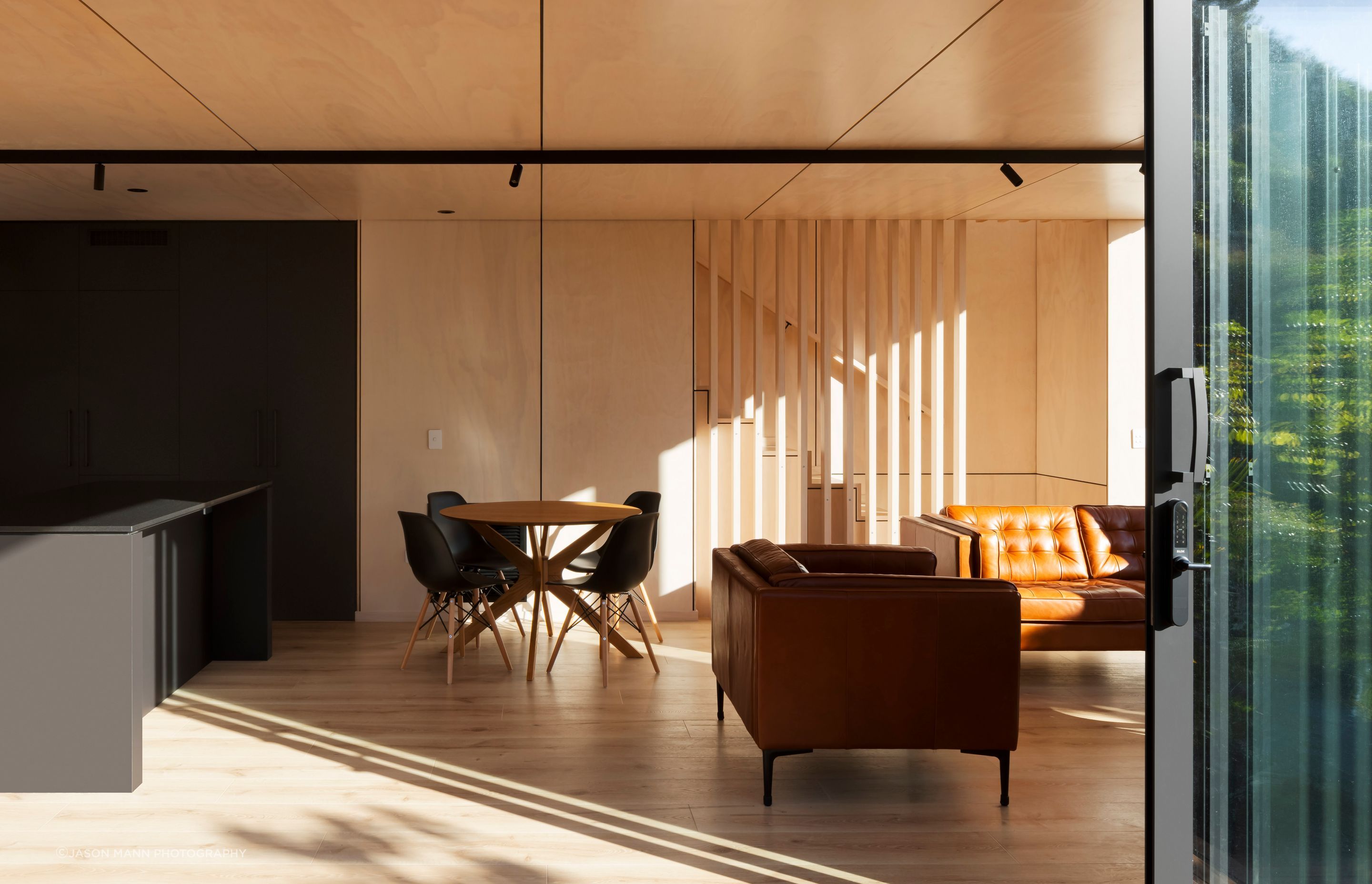 A liberal use of natural materials such as the LVL and timber-framed structure, timber interior finishes and FSC timber decking, along with high thermal performance glazing and ducted heat pump system, has helped the homeowners achieve a highly sustainabl