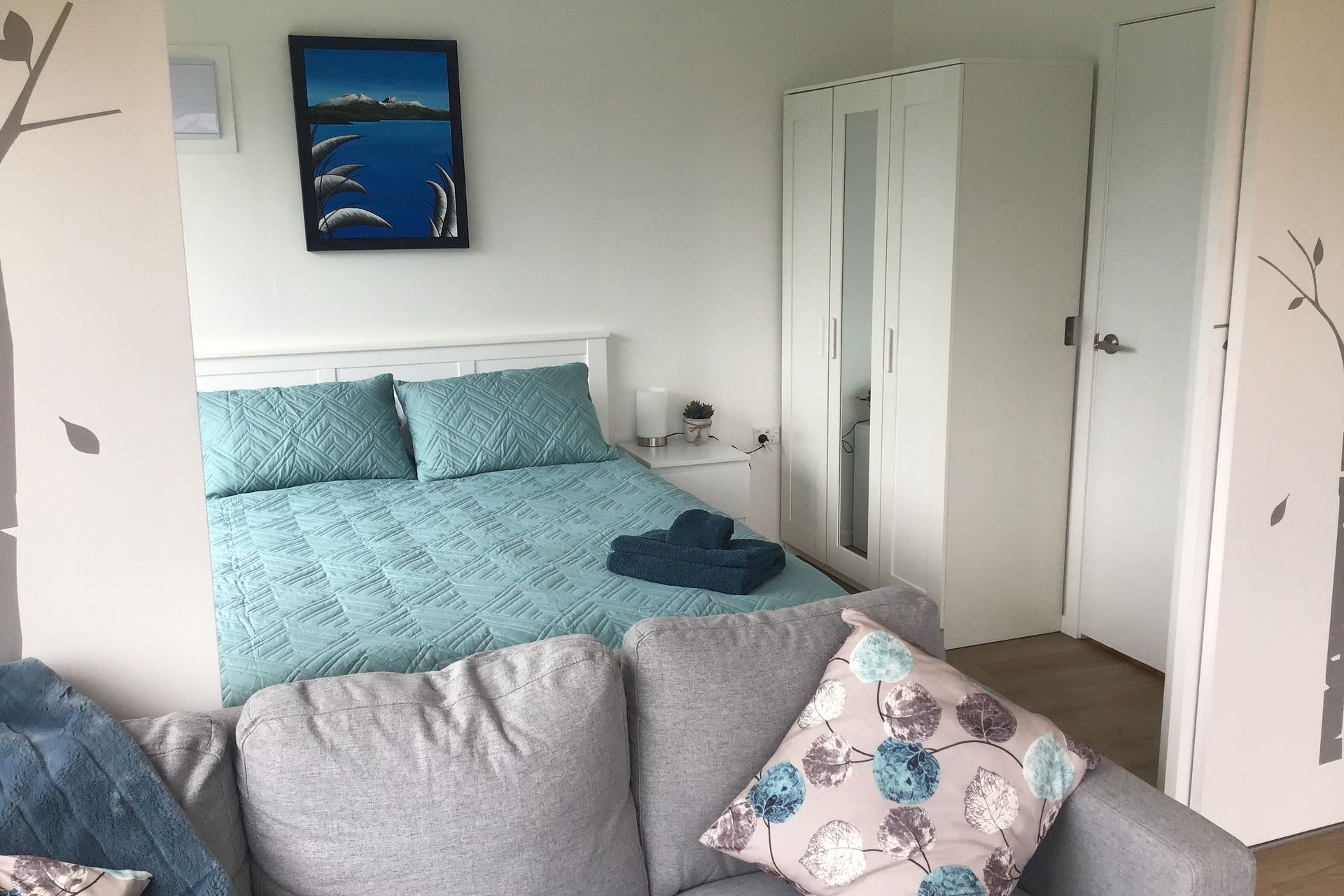 Sliding doors can close off bedroom or open to provide a studio feel