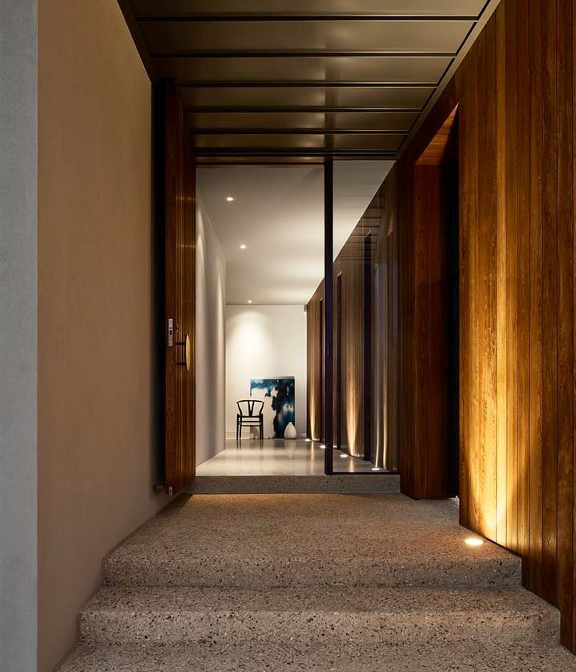 Up-lit timber walls lead guests into the darker, moodier, lower floor.