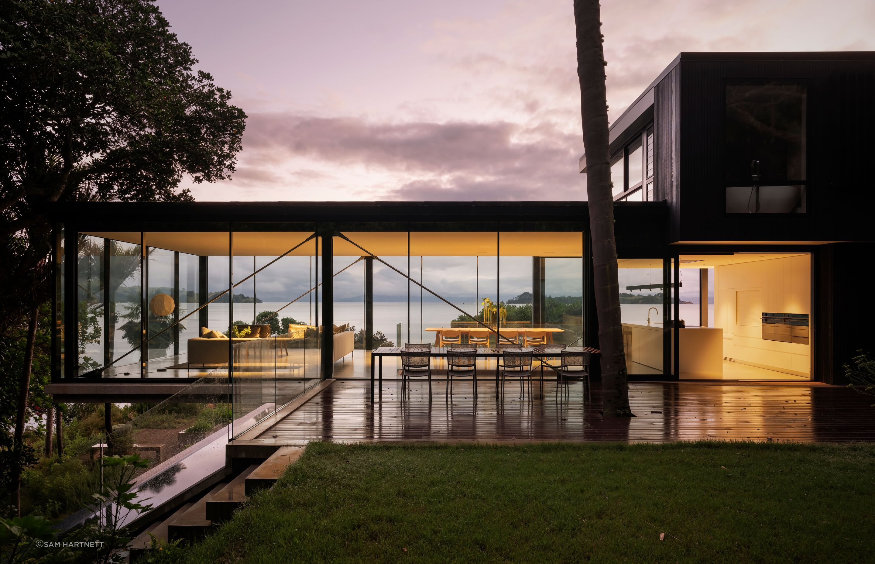 Open outdoor living leading towards the deck and the interior connection to its seaside surroundings.