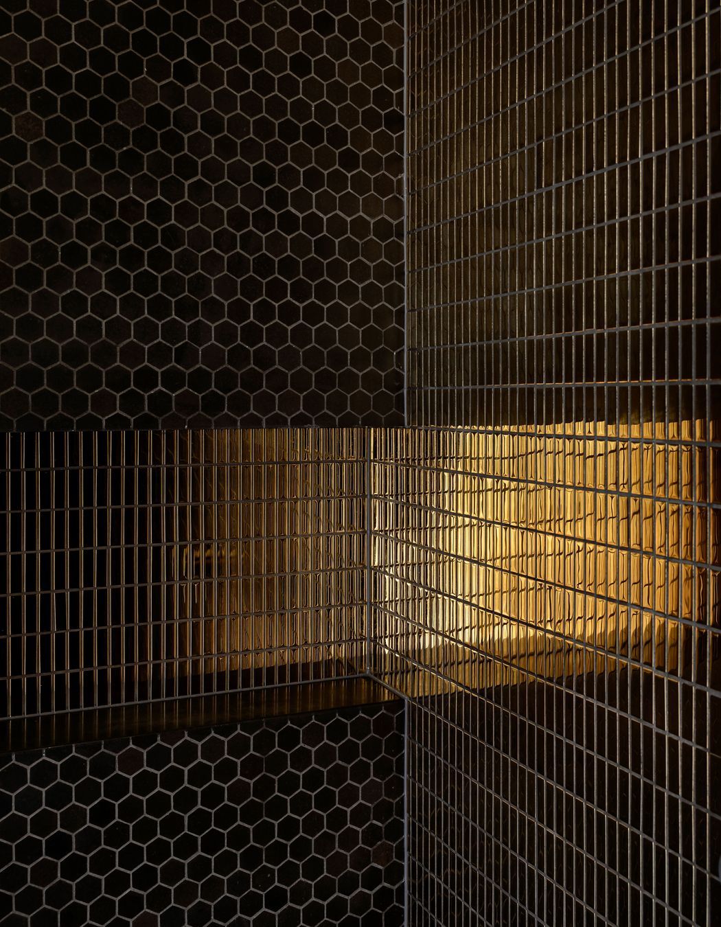 A gold tile was chosen to give the bathroom some "bling".