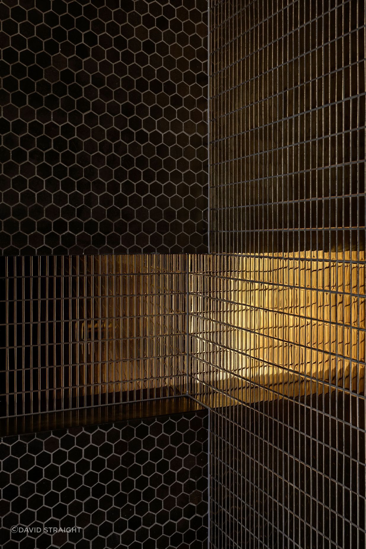 A gold tile was chosen to give the bathroom some "bling".