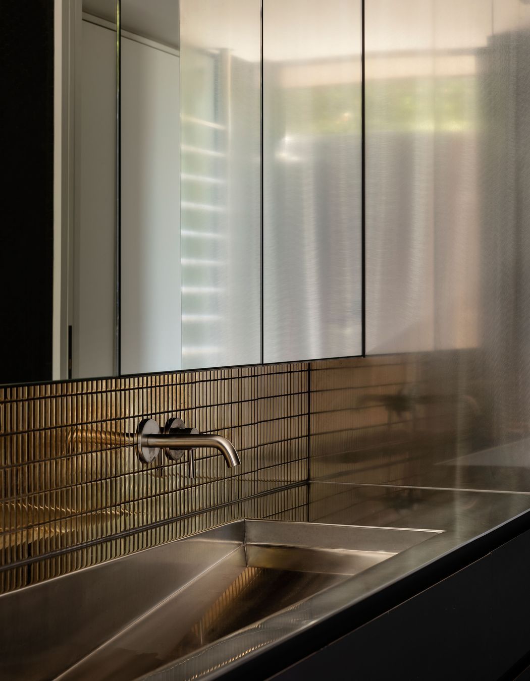 The downstairs guest bathroom provides a "magpie" like element.