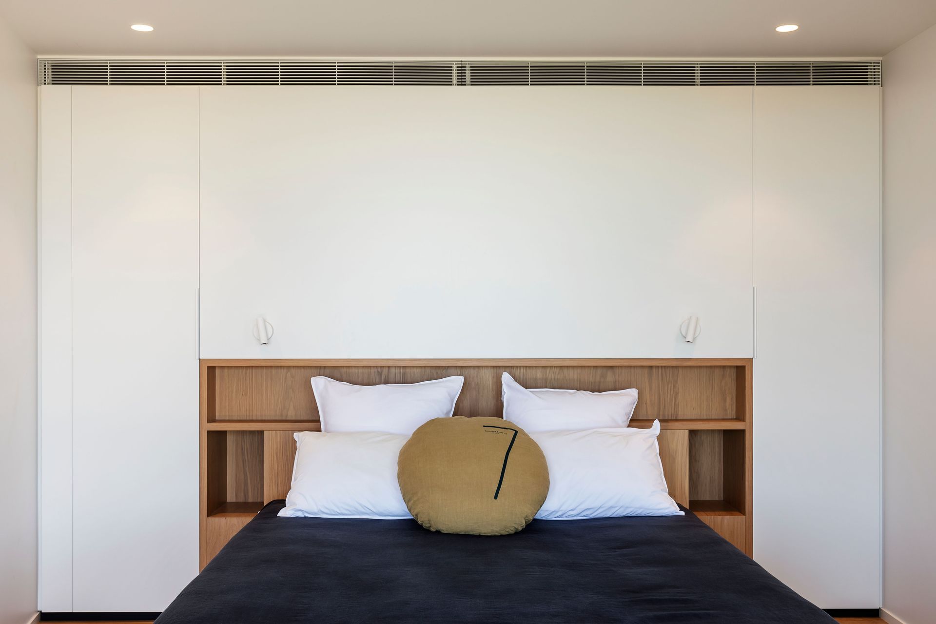 A guest room is bright and airy.