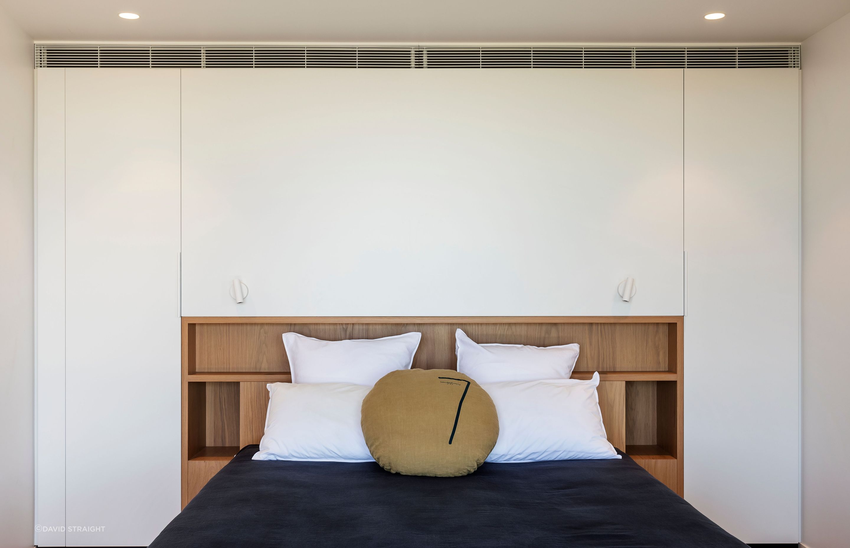 A guest room is bright and airy.