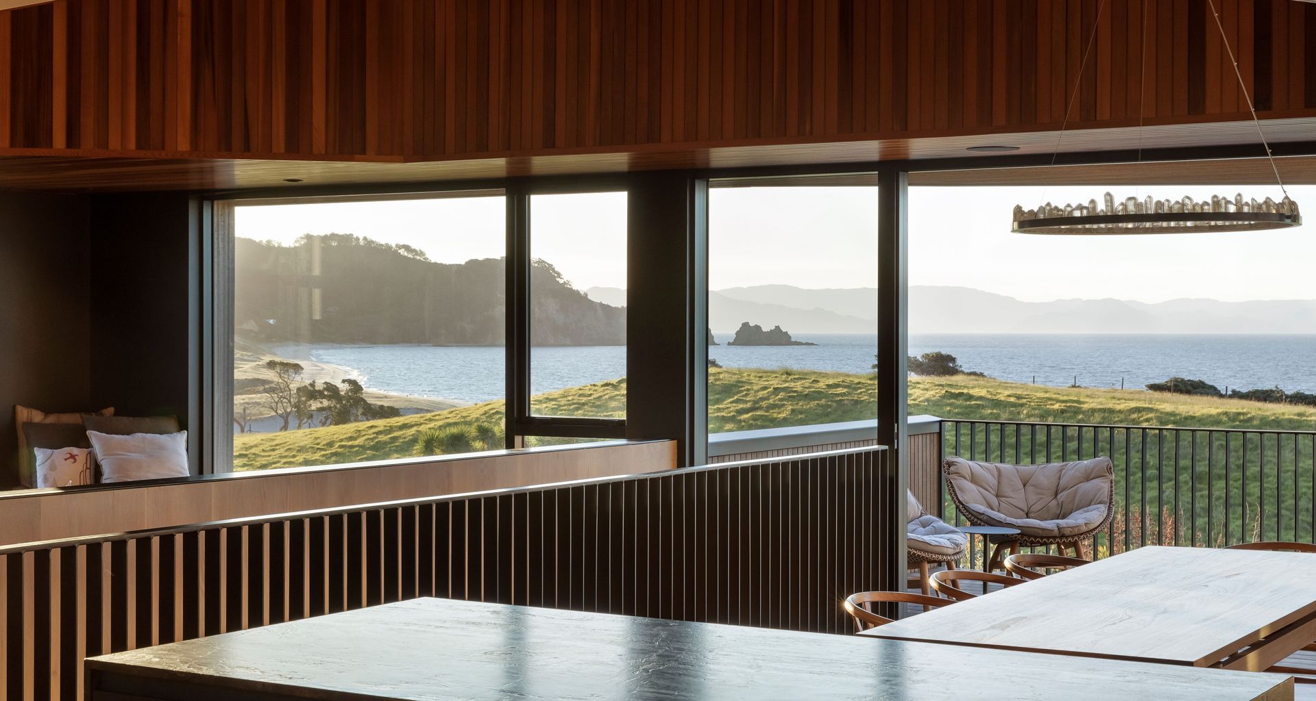 A richly textured beach home with views from hill to horizon banner