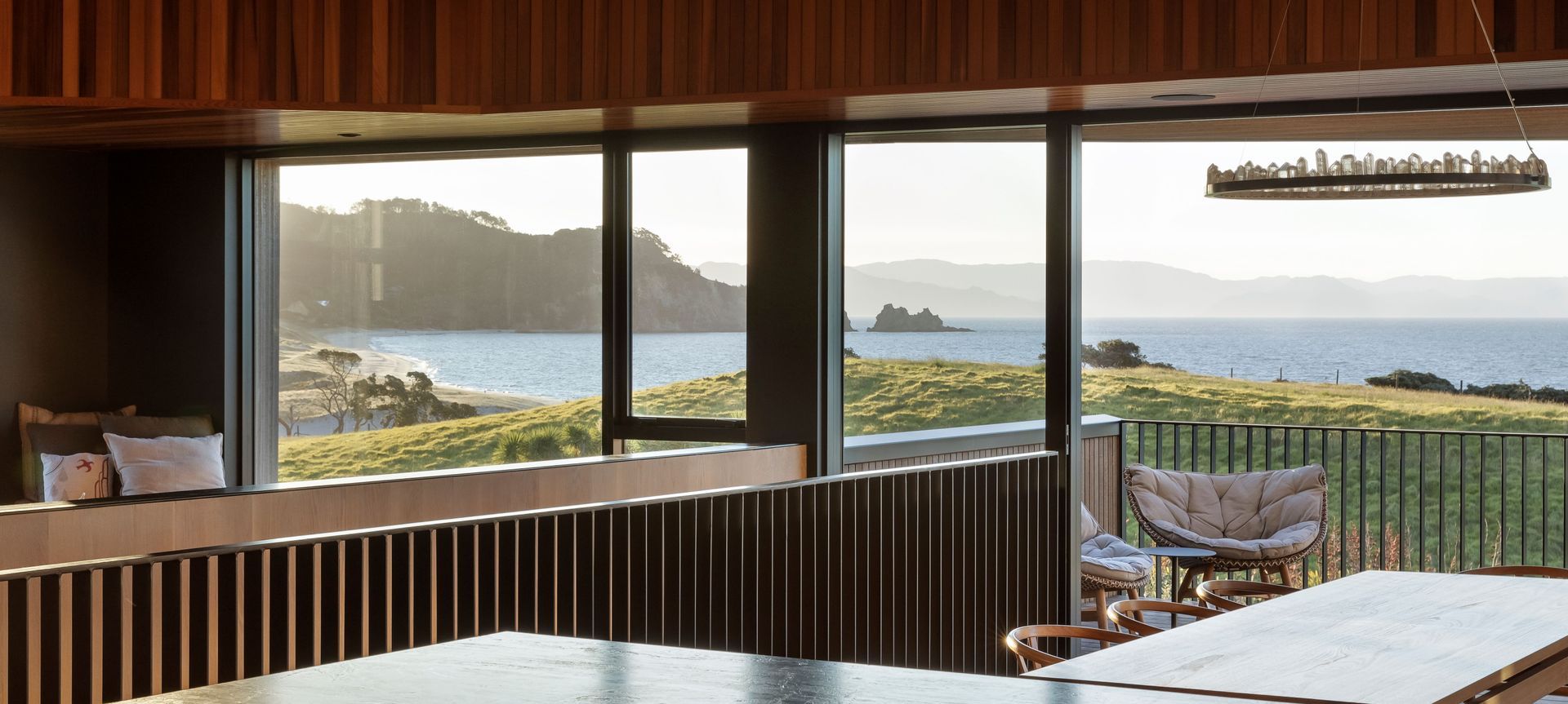 A richly textured beach home with views from hill to horizon banner