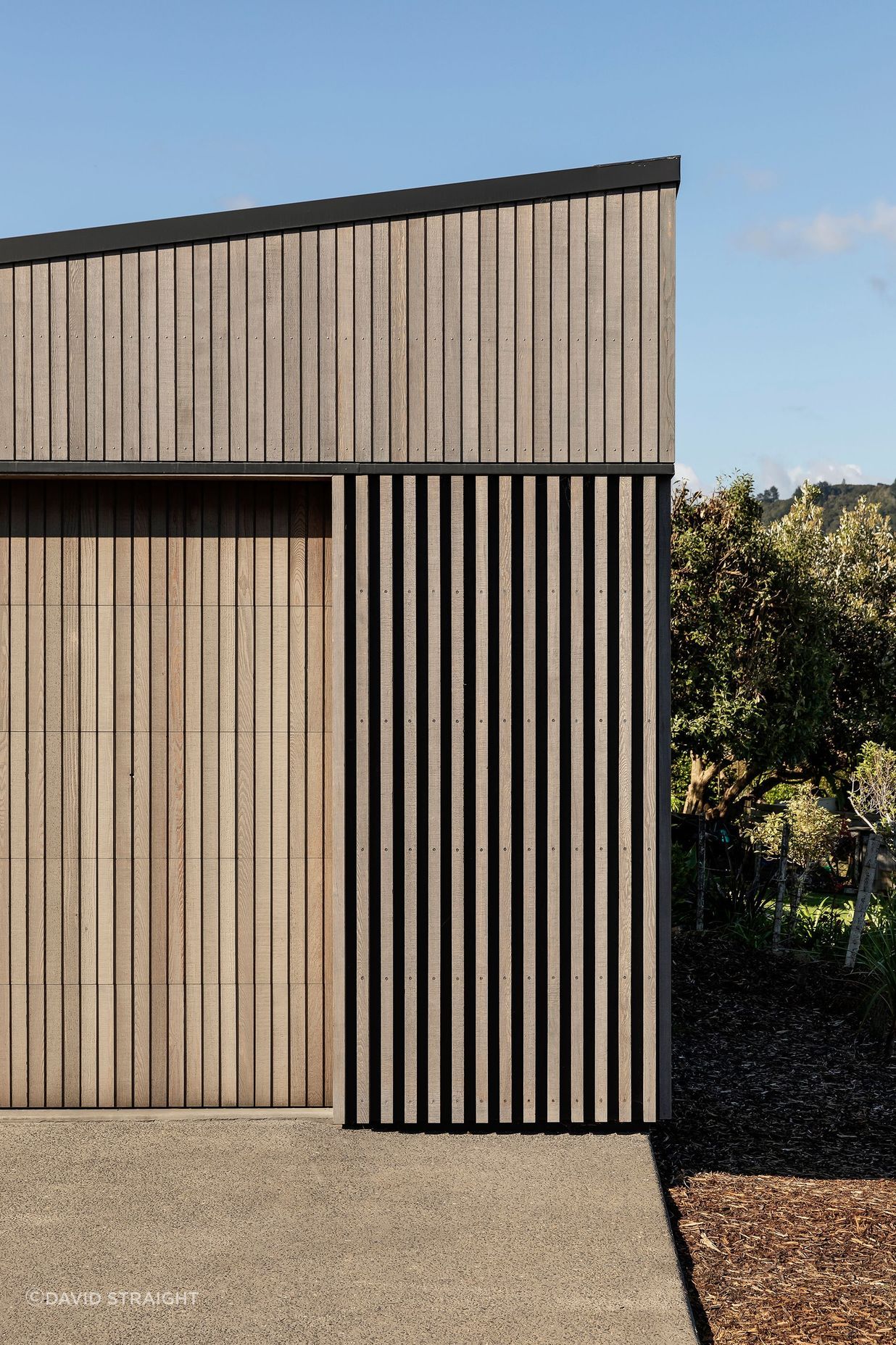 The garage was conceived a separate form and sits below the house on the site.