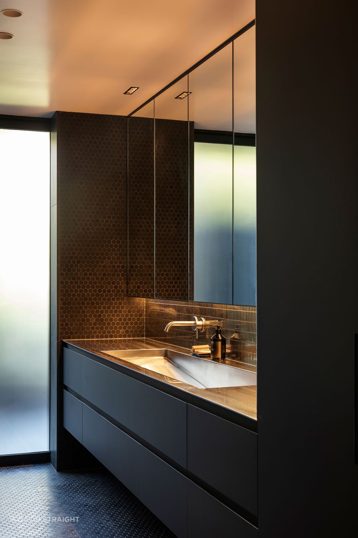 The shared bathroom is glamorous and large enough for a bunch of teenagers to get ready together.