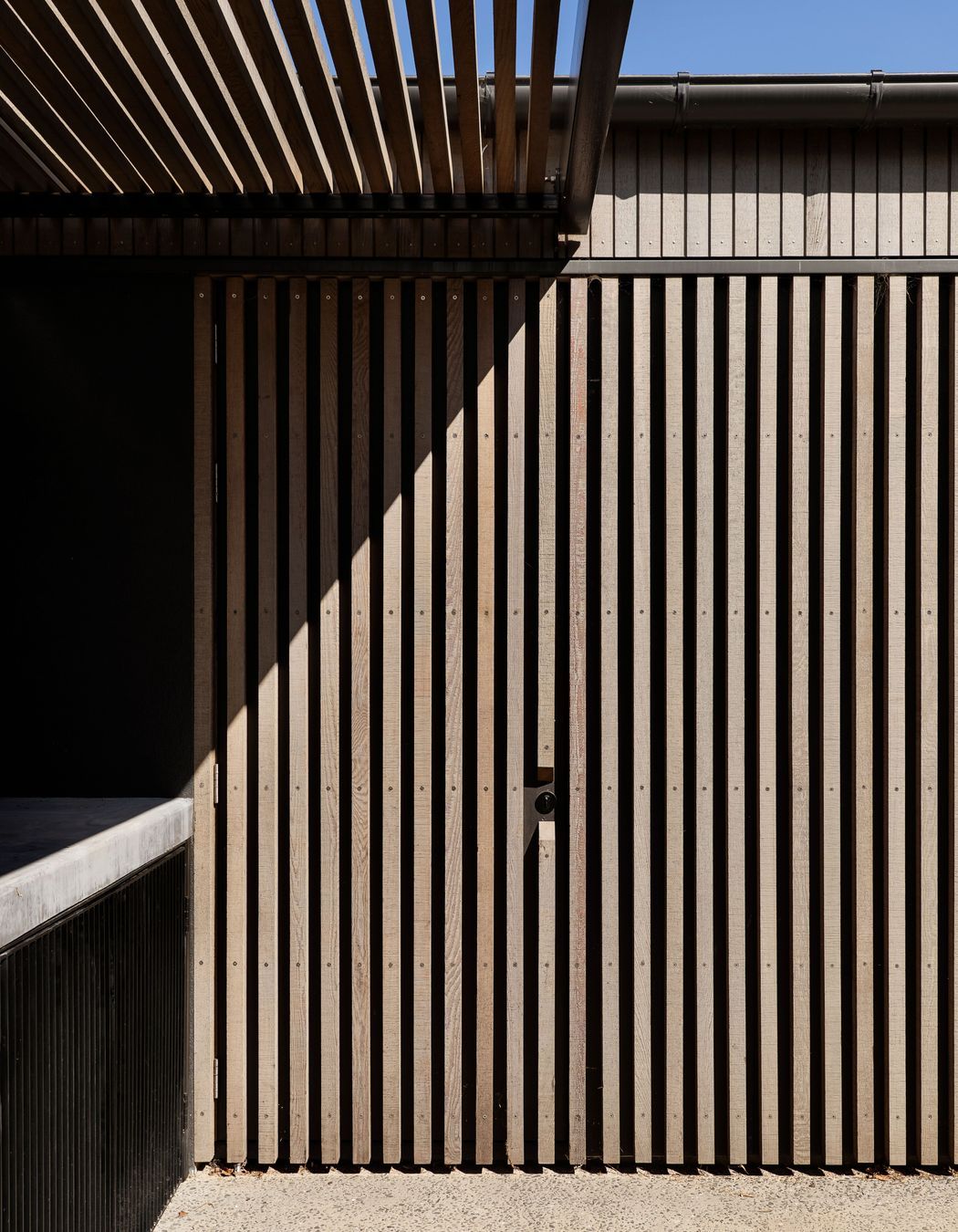 A bespoke concrete filleting bench was designed into the recess adjacent to the garage,