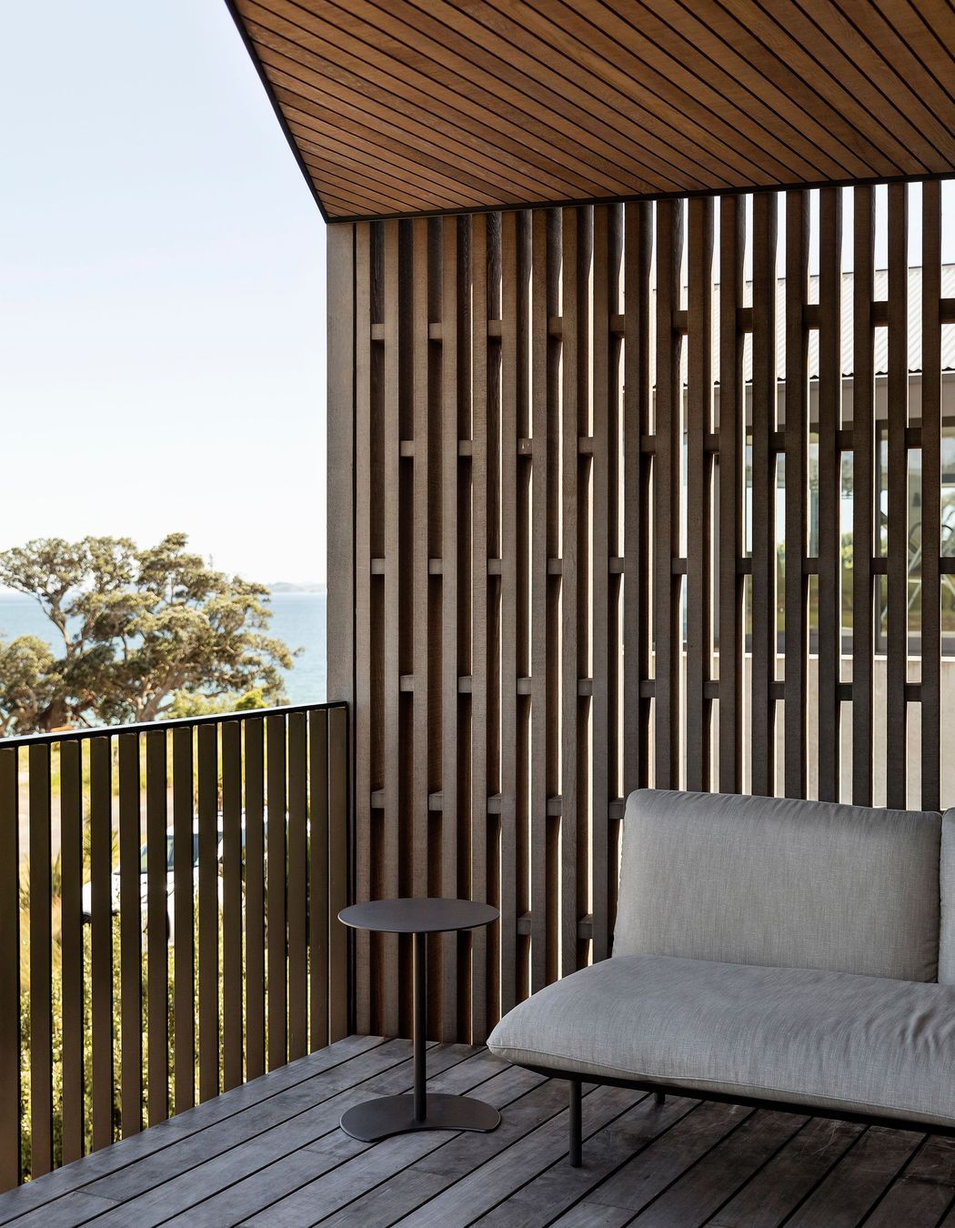 The outdoor deck at the front of the home is an ideal spot for evening drinks.