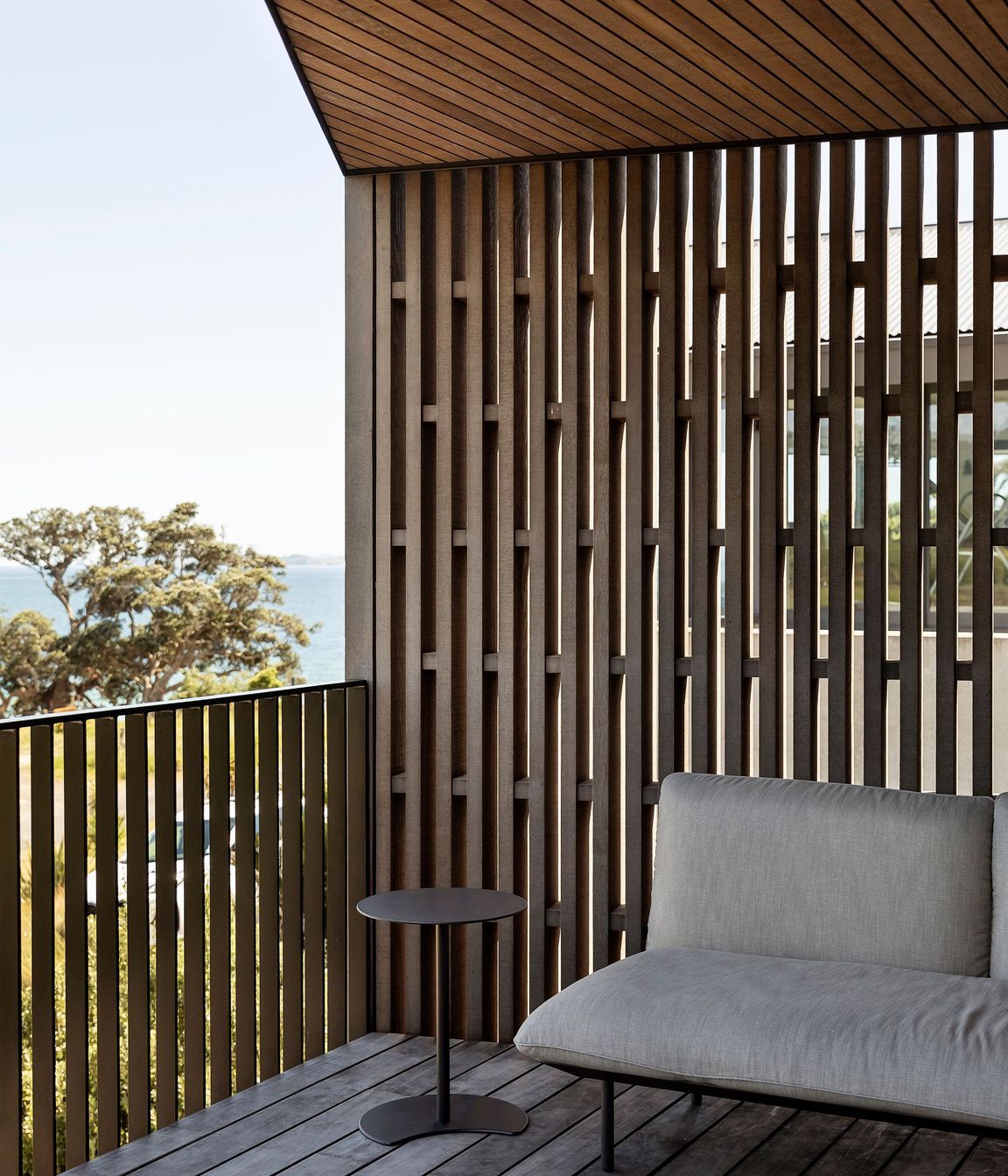 The outdoor deck at the front of the home is an ideal spot for evening drinks.