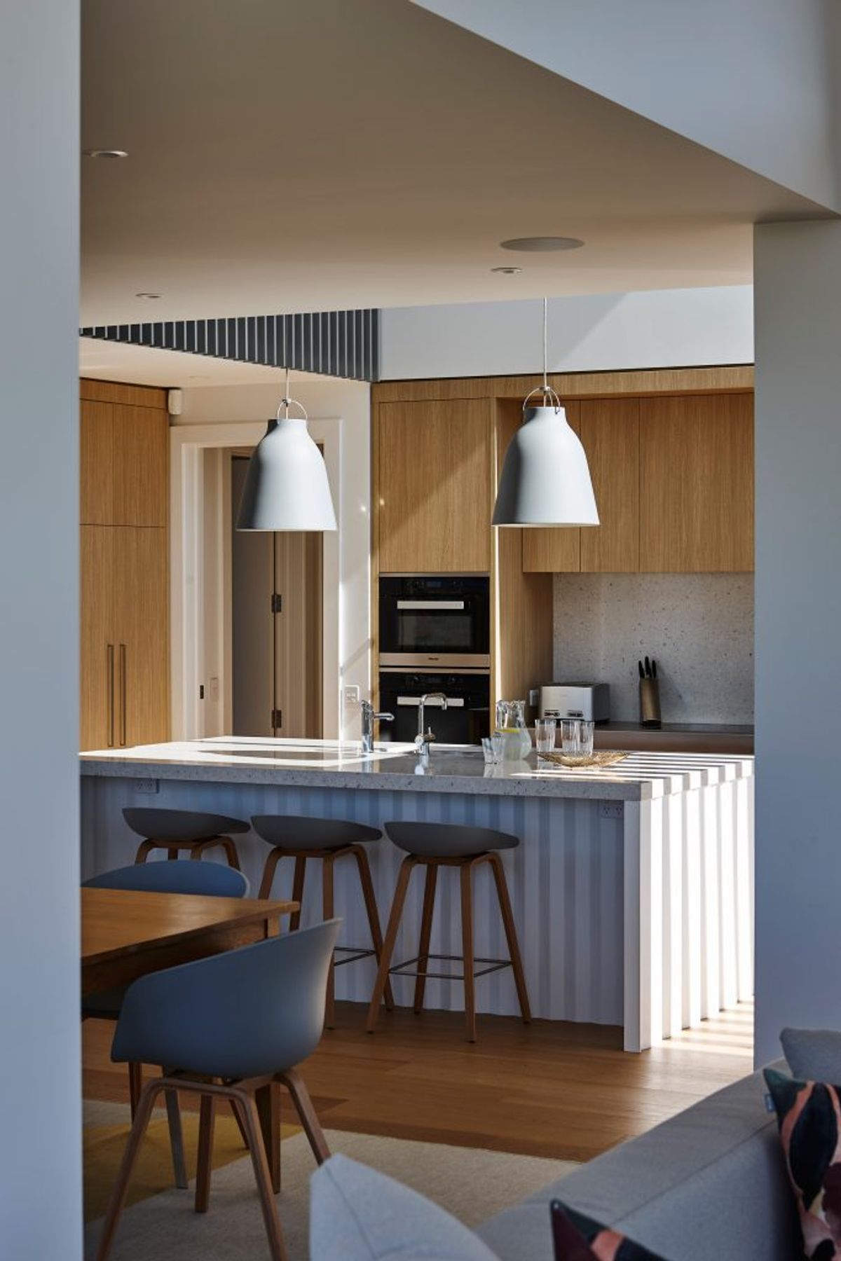 “There's quite a beautiful detail under the island bench where it has a folded origami base. We were really pleased with how they turned out. It has a little bit of crispness and a little bit of elegance to it but without being too full on,” says Kate.
