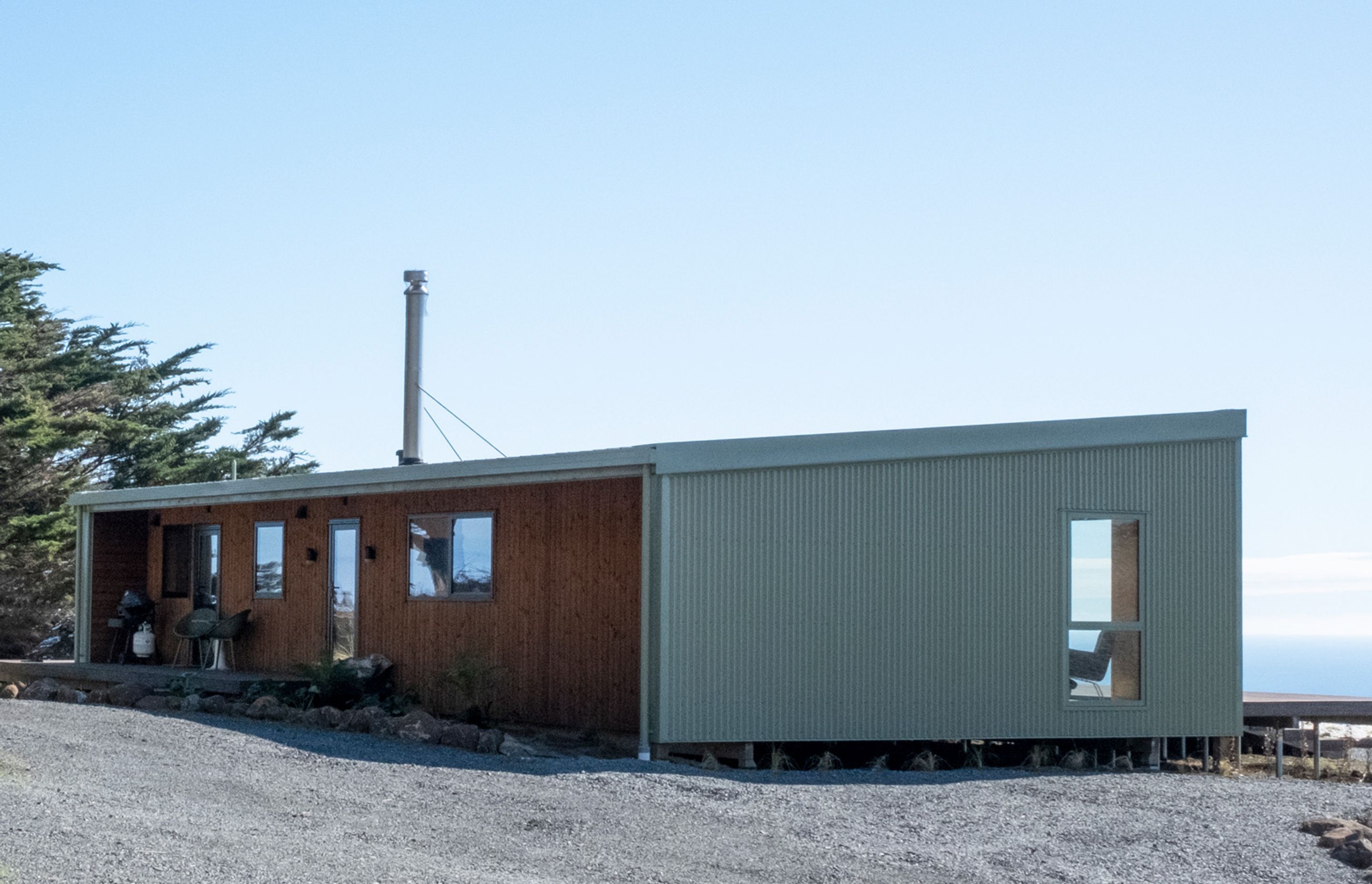 Mist green Colorsteel corrugate meets vertical Nordic Pine cladding