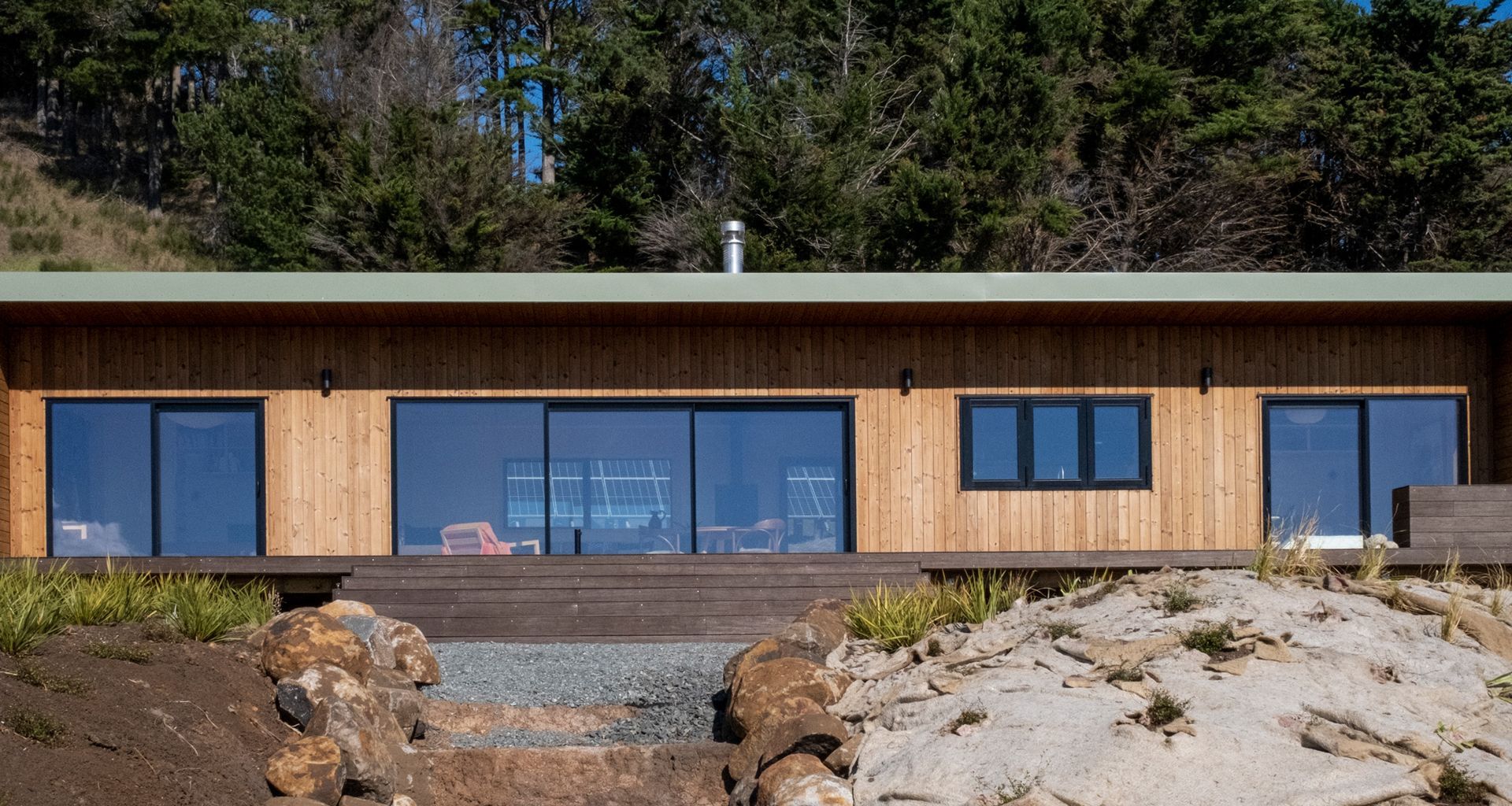 This 2 bedroom Batch presents a clean and simple design highlighting a contrast of natural tones.