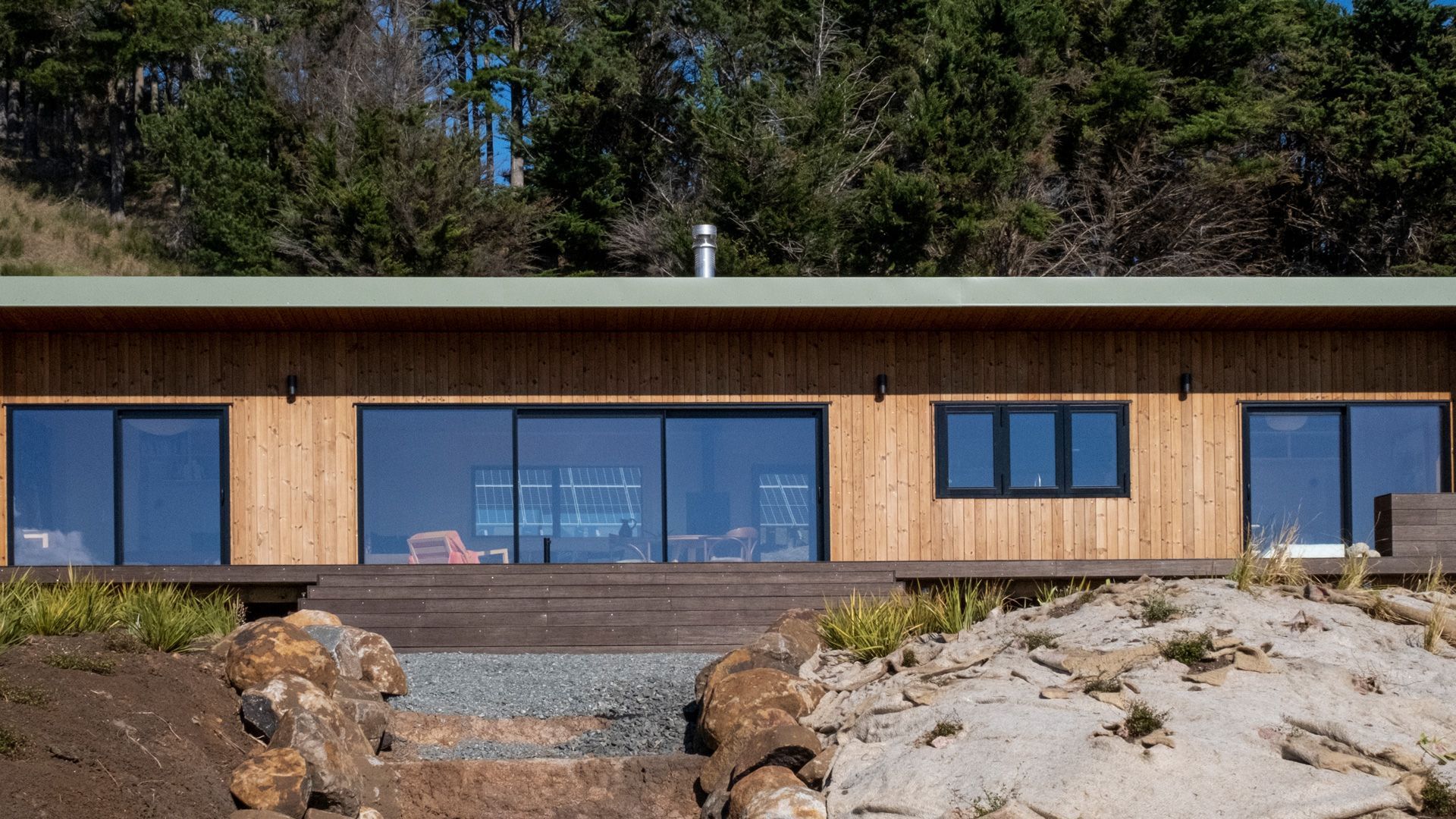 This 2 bedroom Batch presents a clean and simple design highlighting a contrast of natural tones.