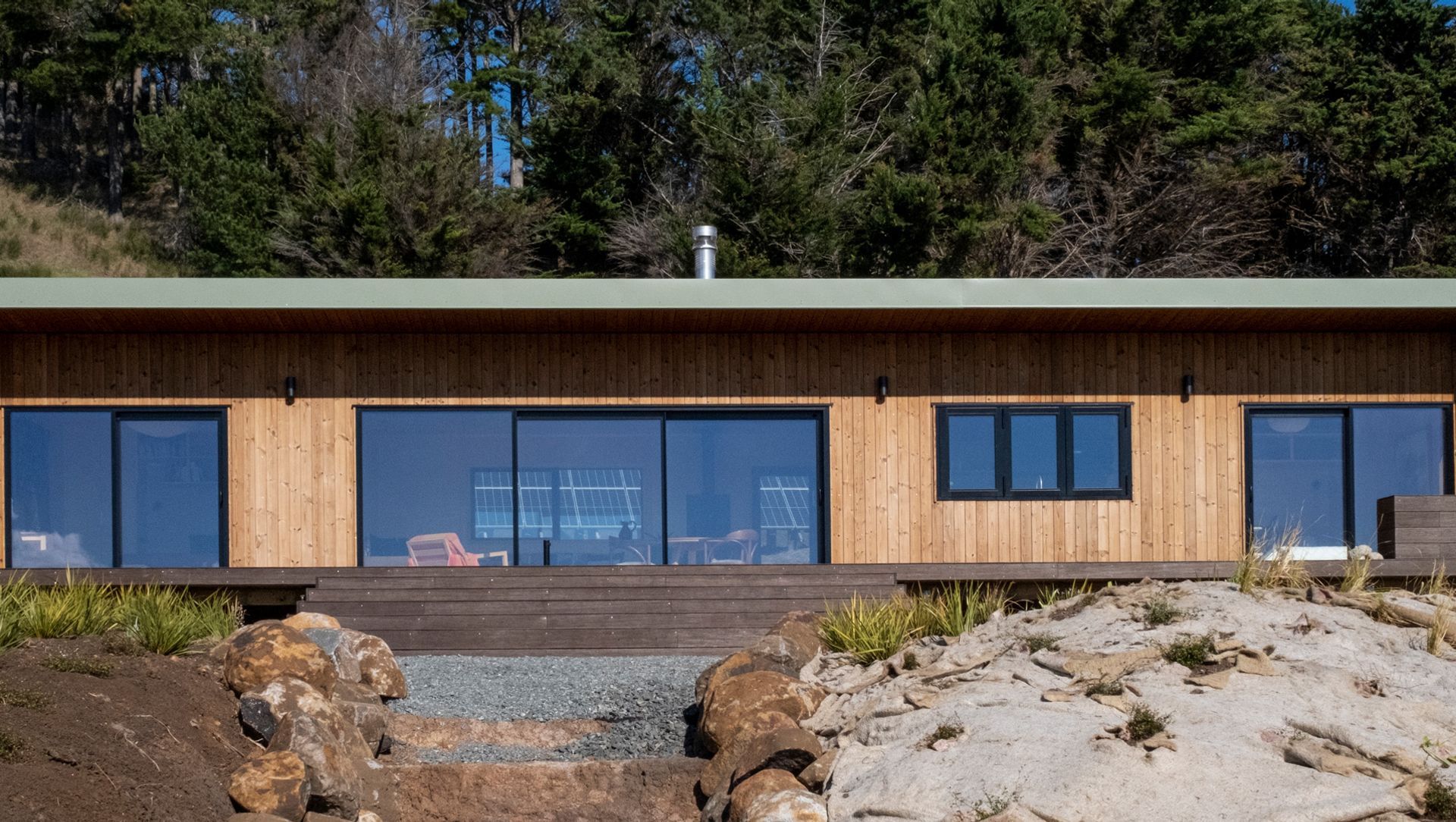 This 2 bedroom Batch presents a clean and simple design highlighting a contrast of natural tones.