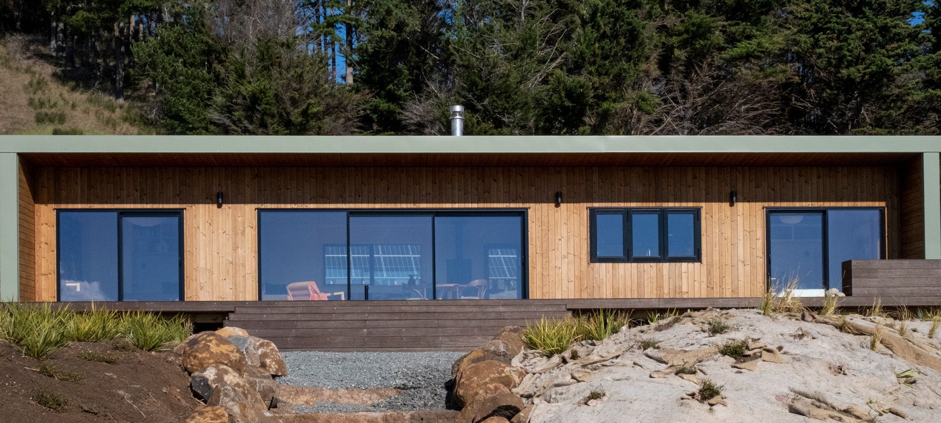 This 2 bedroom Batch presents a clean and simple design highlighting a contrast of natural tones.