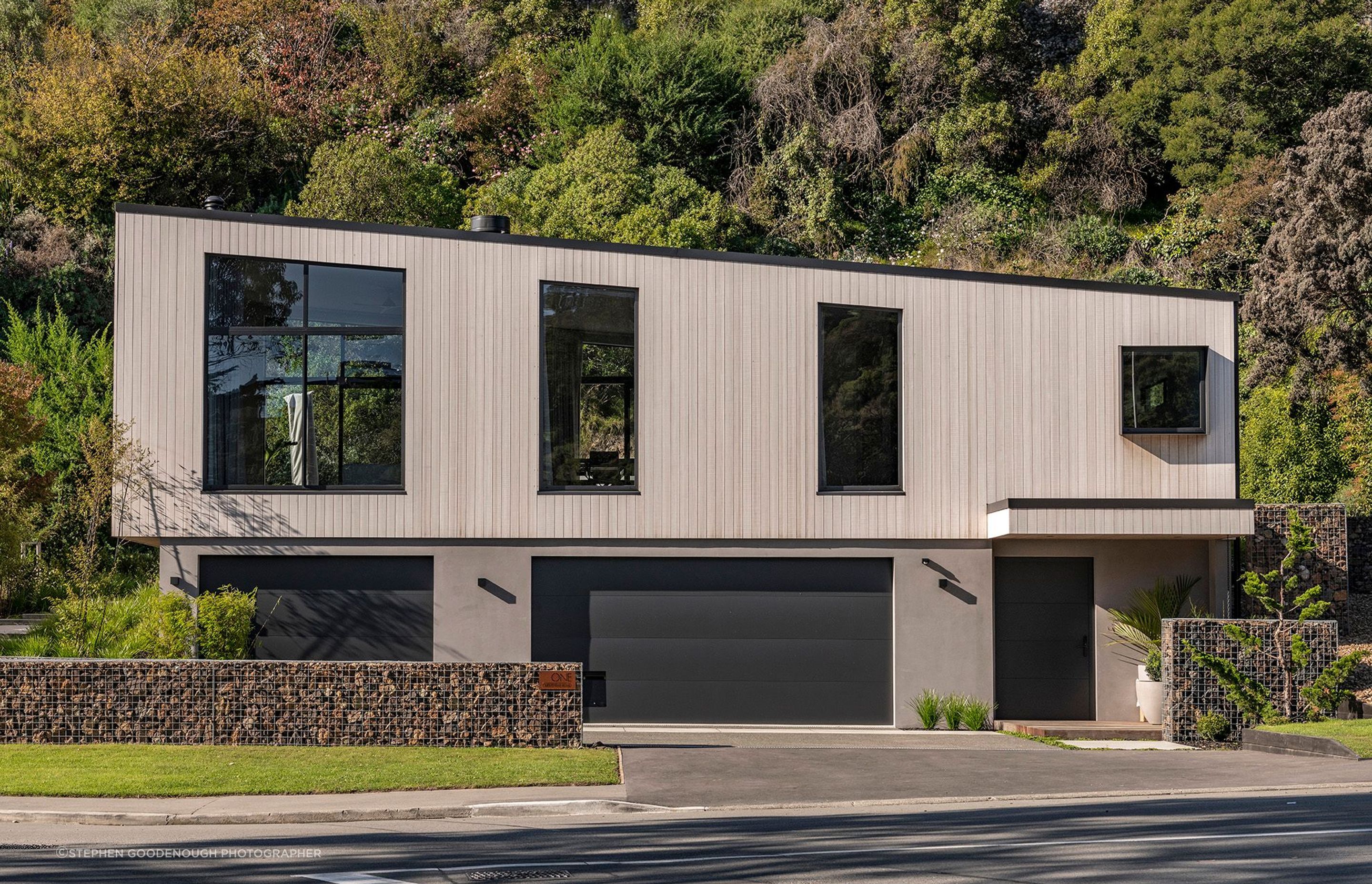 It was important the home reflected its surroundings and was sympathetic to the wider  environment. A combination of natural coloured material choice and a low pitch sloped roofline has  aided the amalgamation between the two.