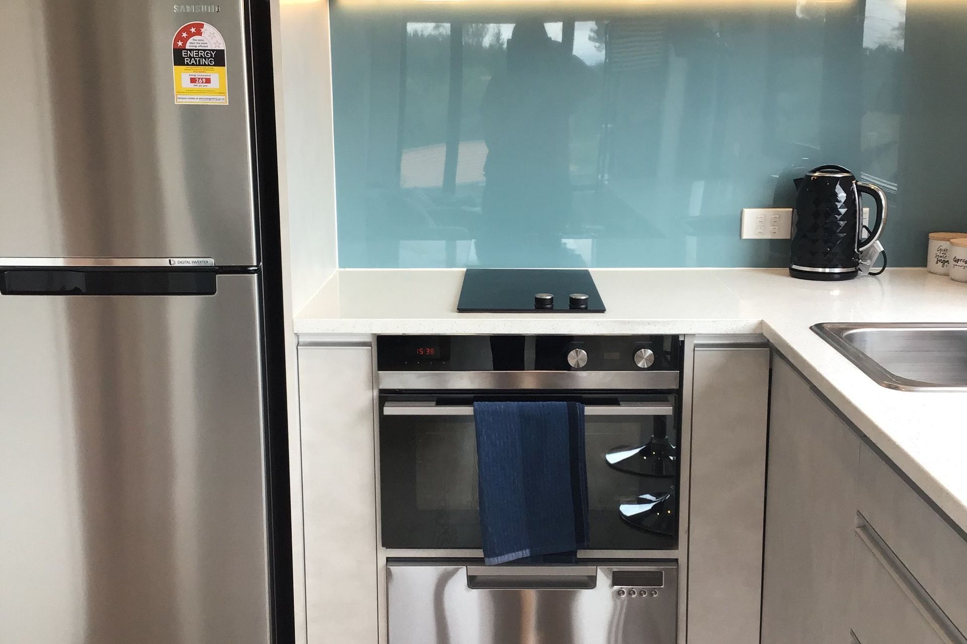 Kitchen features modern appliances such as F&P dish drawer, compact oven & 2bnr hob