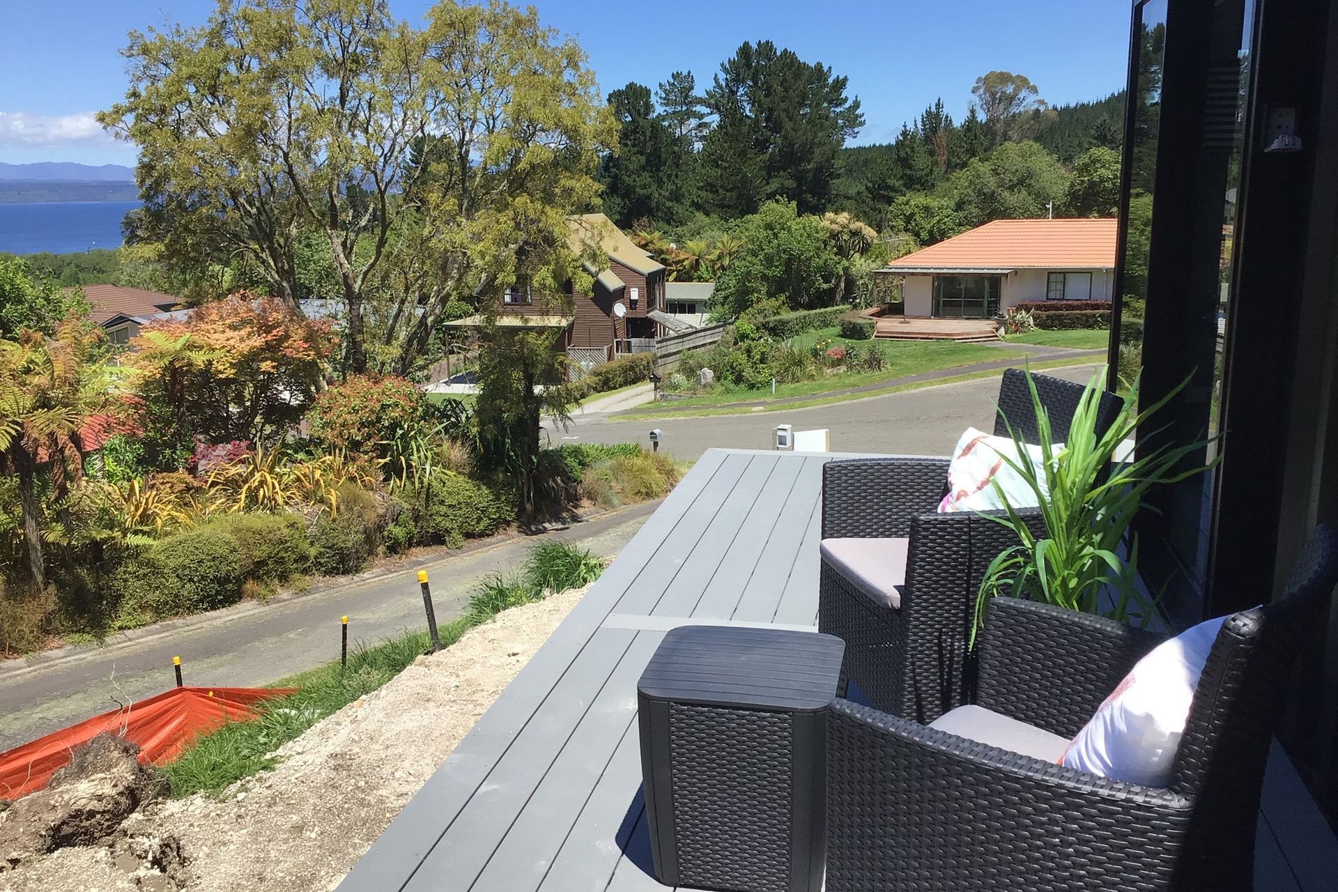 Relax on the sunny deck overlooking the lake