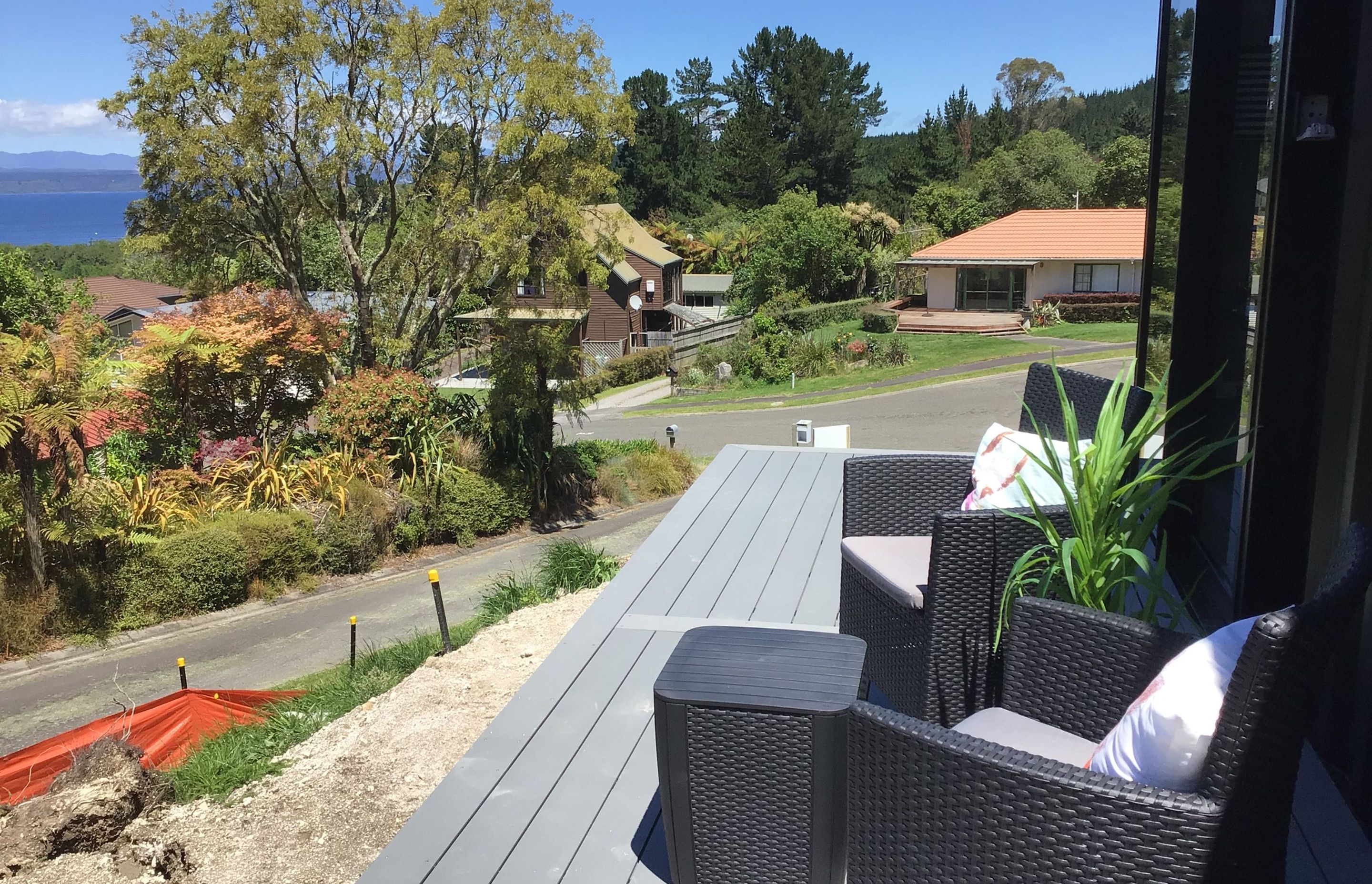 Relax on the sunny deck overlooking the lake