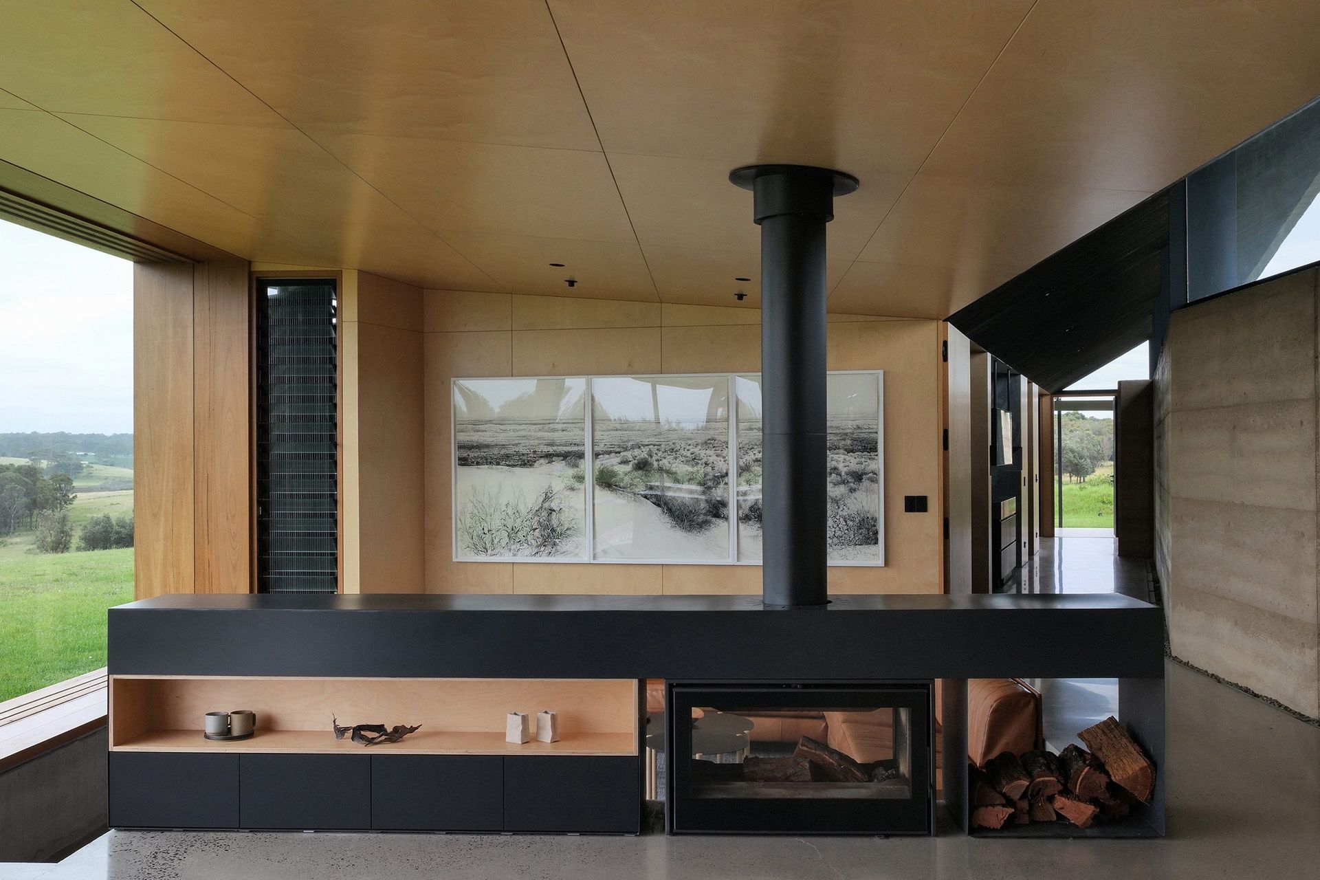 The Axis i1000 Freestanding Double Sided wood fireplace by Sculpt Fireplace Collection was the perfect room divider for Mystery Bay House