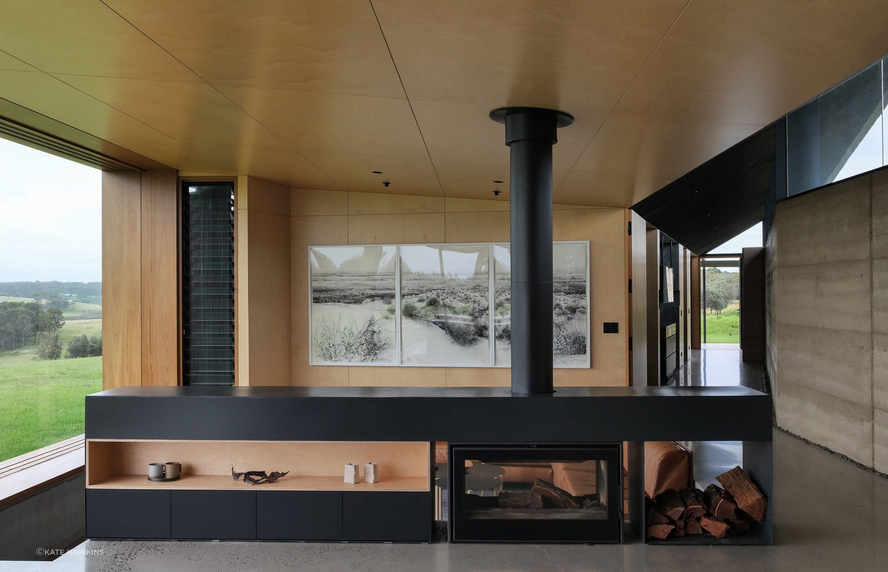 The Axis i1000 Freestanding Double Sided wood fireplace by Sculpt Fireplace Collection was the perfect room divider for Mystery Bay House