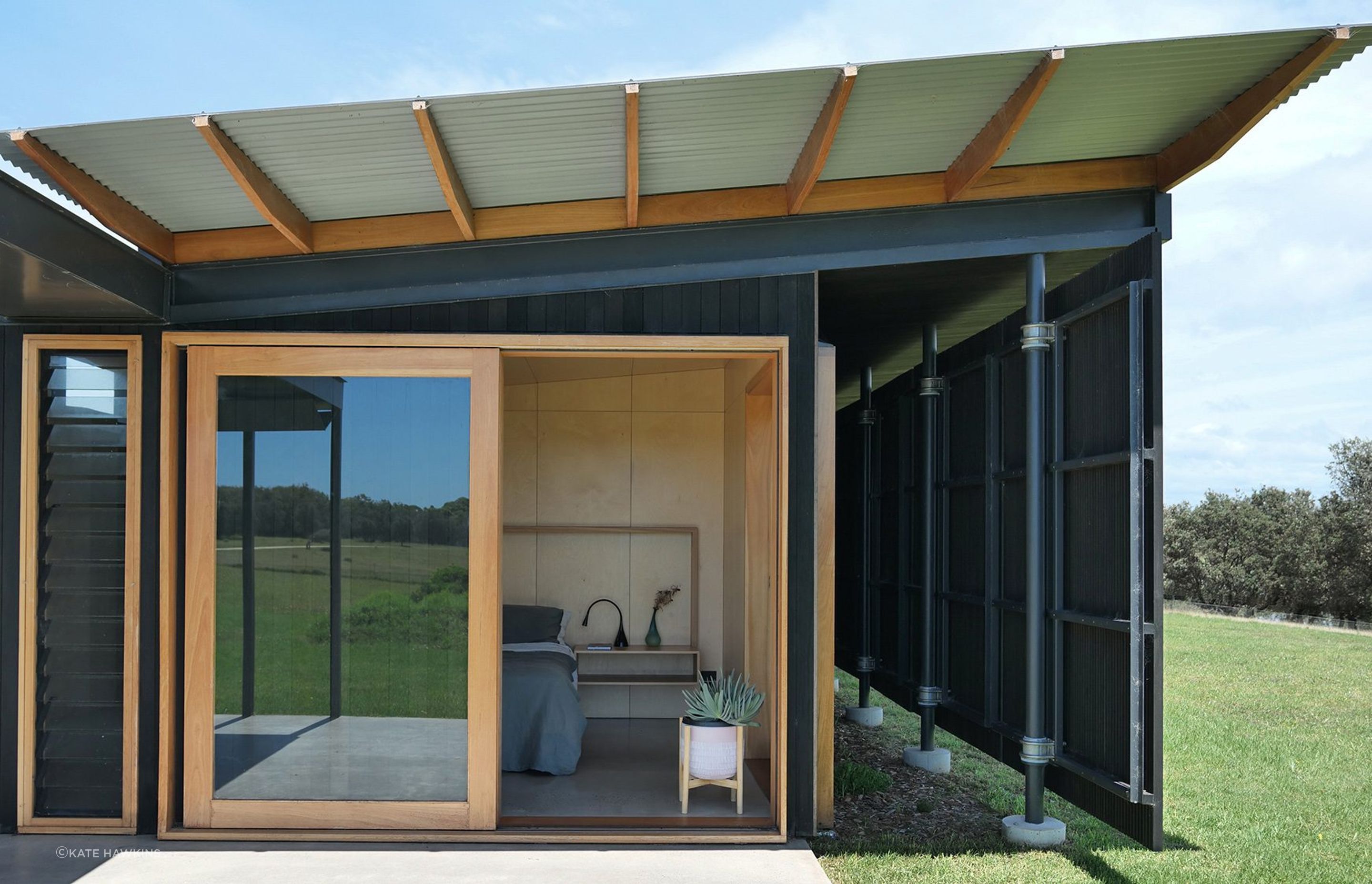 Find tranquility and coastal charm in the bedroom of Mystery Bay House. Unwind, recharge, and embrace the beauty of nature in this serene coastal sanctuary