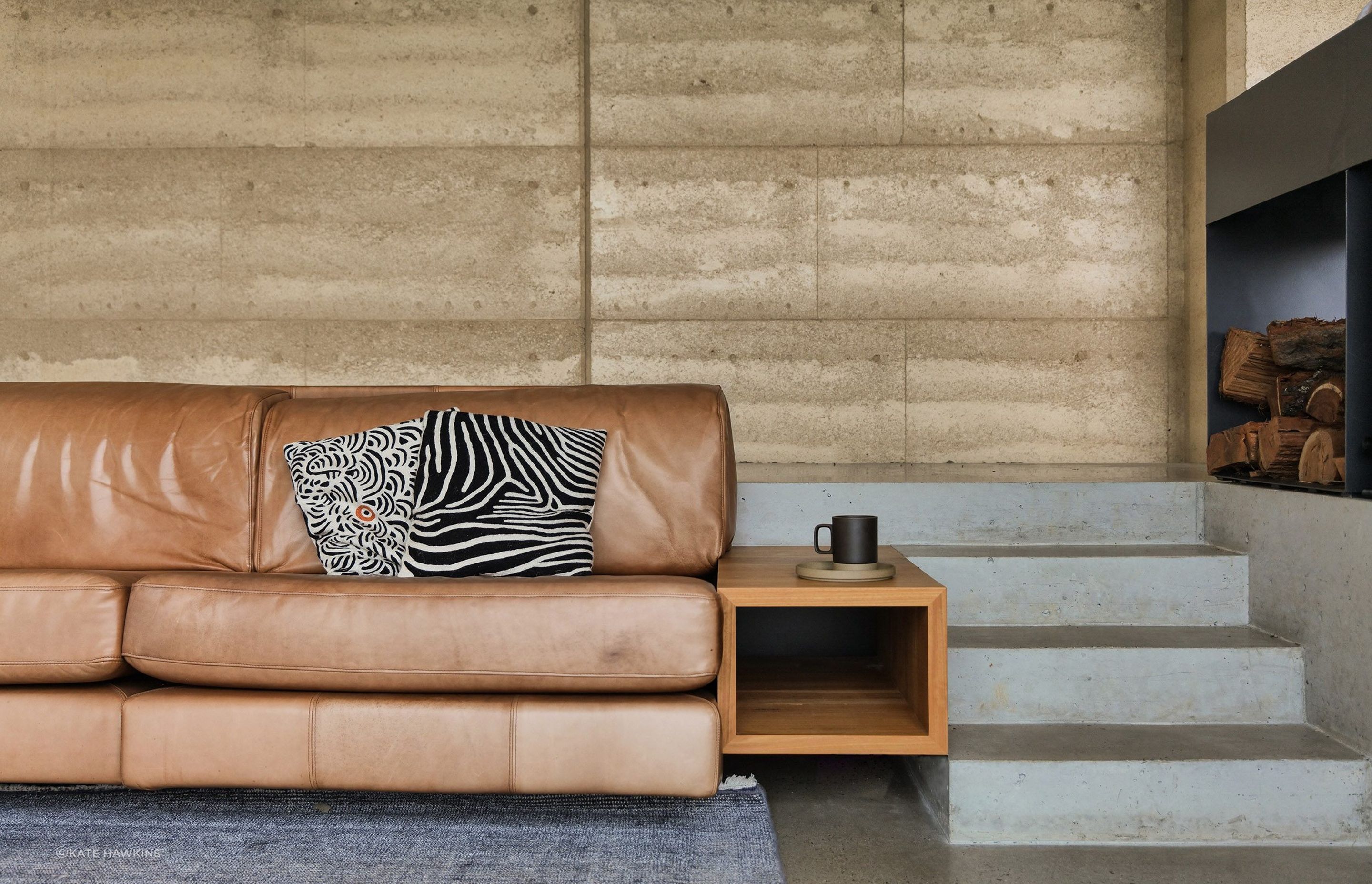 Refined details in the lounge area, perfectly seated next to the luxury Axis i1000 Freestanding Double Sided wood fireplace from Sculpt Fireplace Collection
