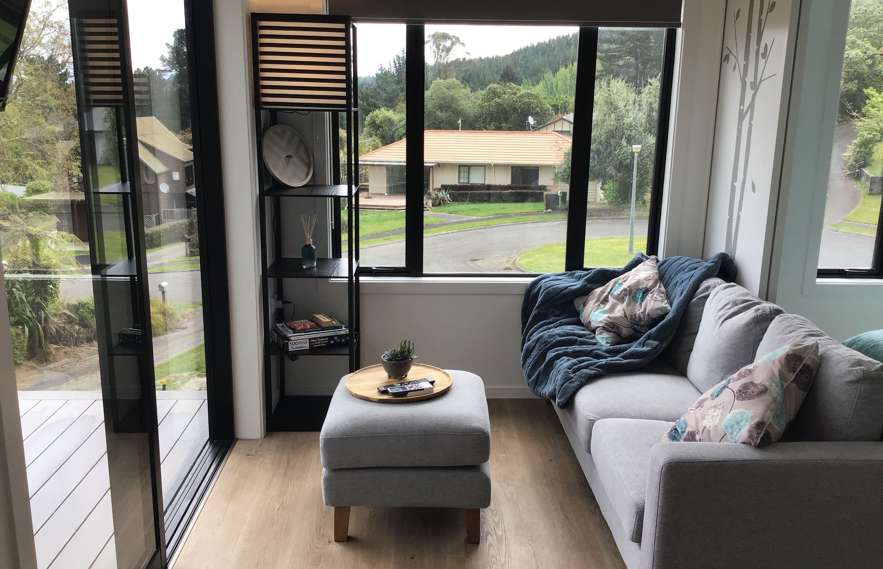 Living room opens onto deck with level threshold for accessibility