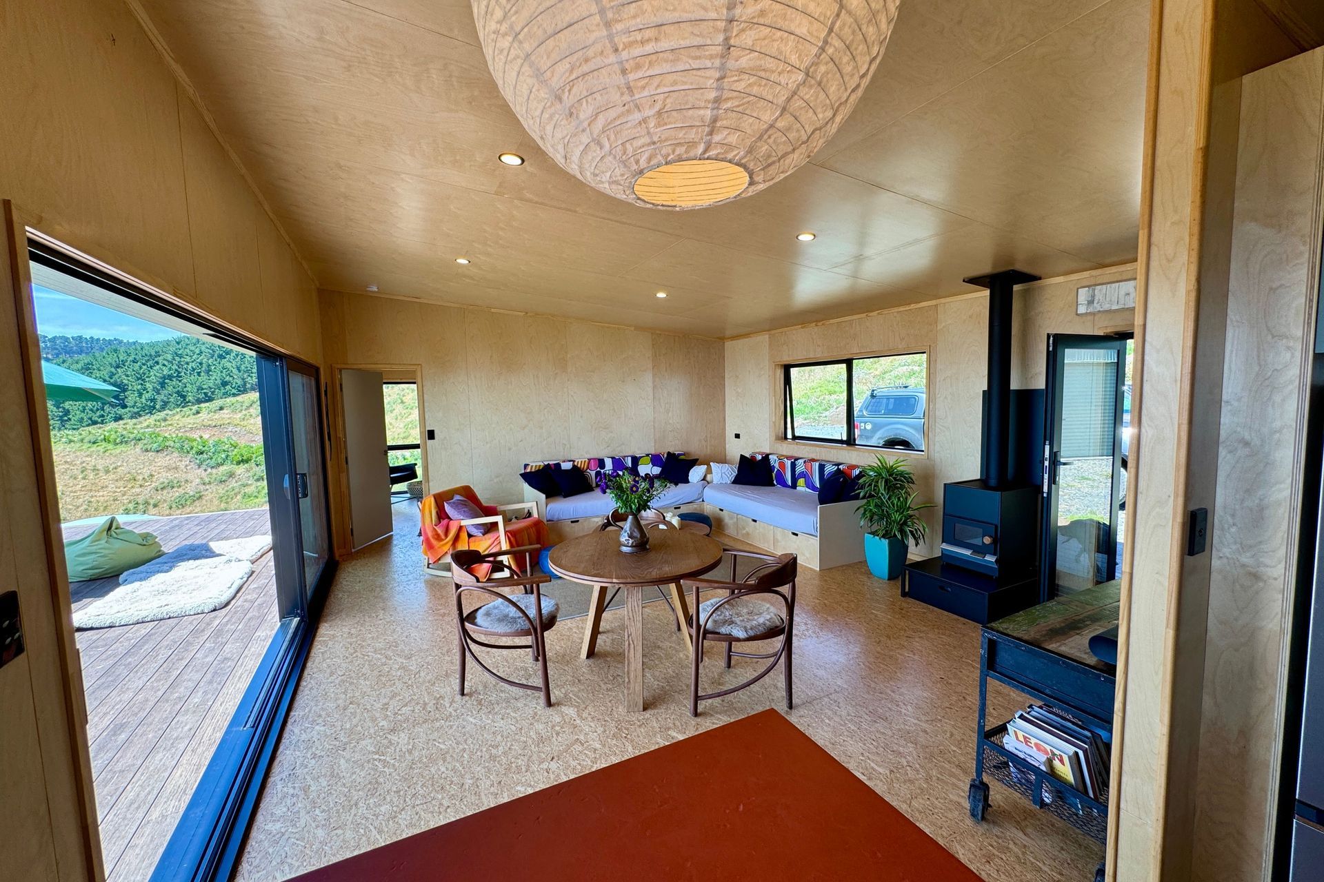 Cosy dining and lounge area featuring OSB Satin flooring