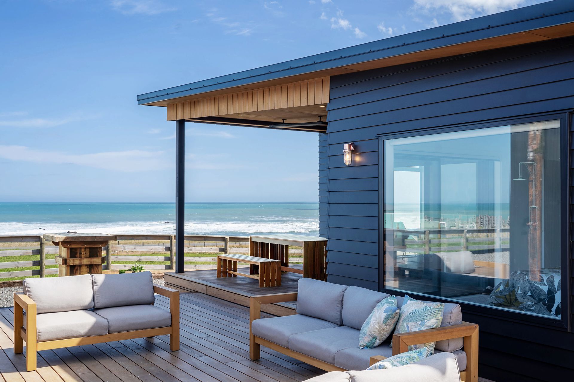 Sheltered outdoor living spaces ensure the sea air can be enjoyed even when the weather is less than favourable