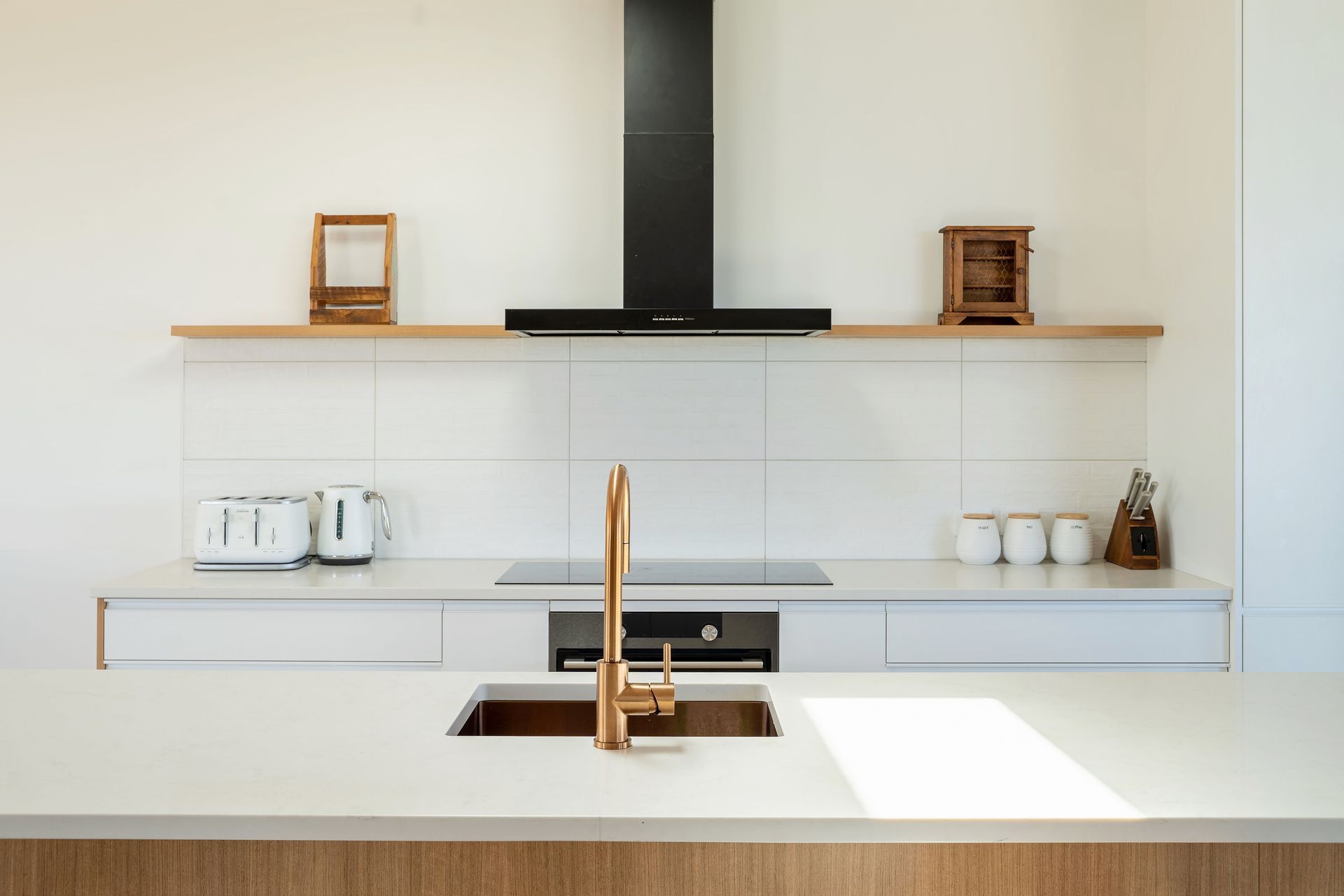 The clean, modern kitchen is the central hub of the living space. Allowing occupants to move from the kitchen outwards in any direction to the most suitable spot for a feed