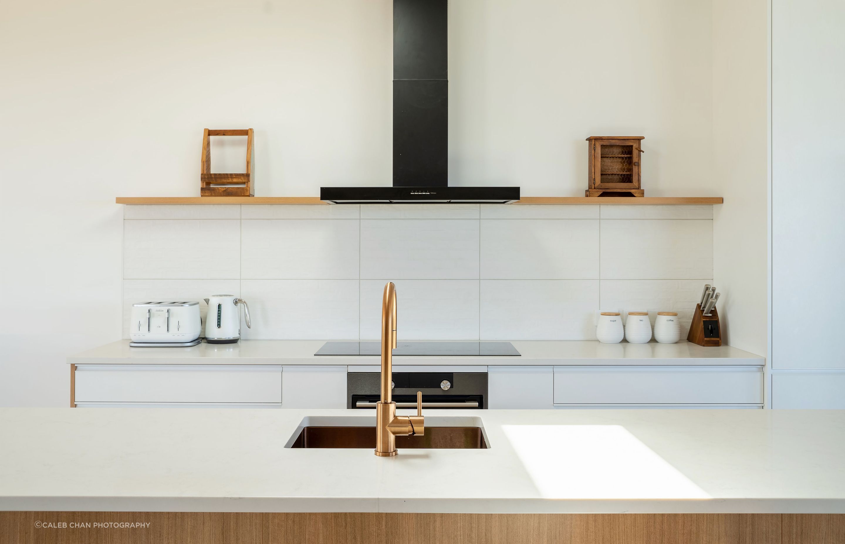 The clean, modern kitchen is the central hub of the living space. Allowing occupants to move from the kitchen outwards in any direction to the most suitable spot for a feed