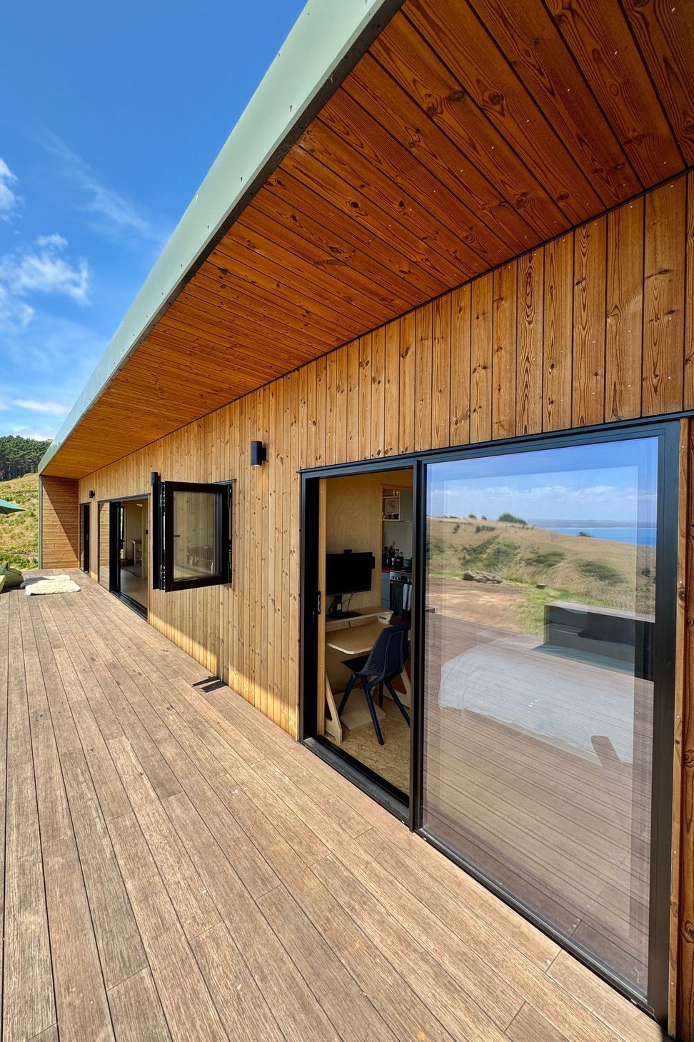 Designer soffit with vertical Nordic Pine cladding and Bamboo decking