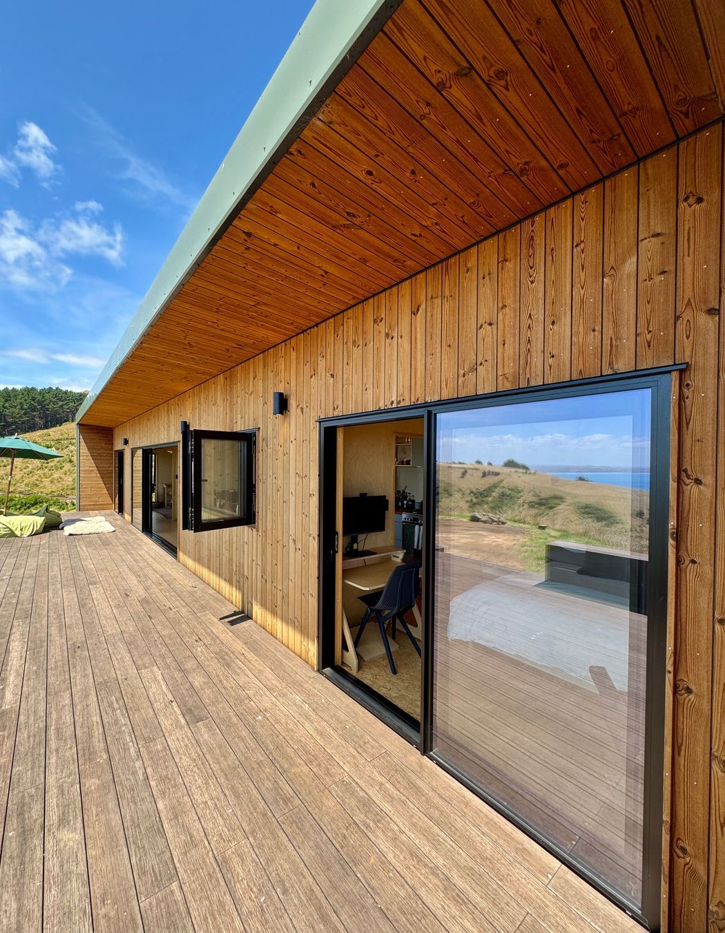 Designer soffit with vertical Nordic Pine cladding and Bamboo decking